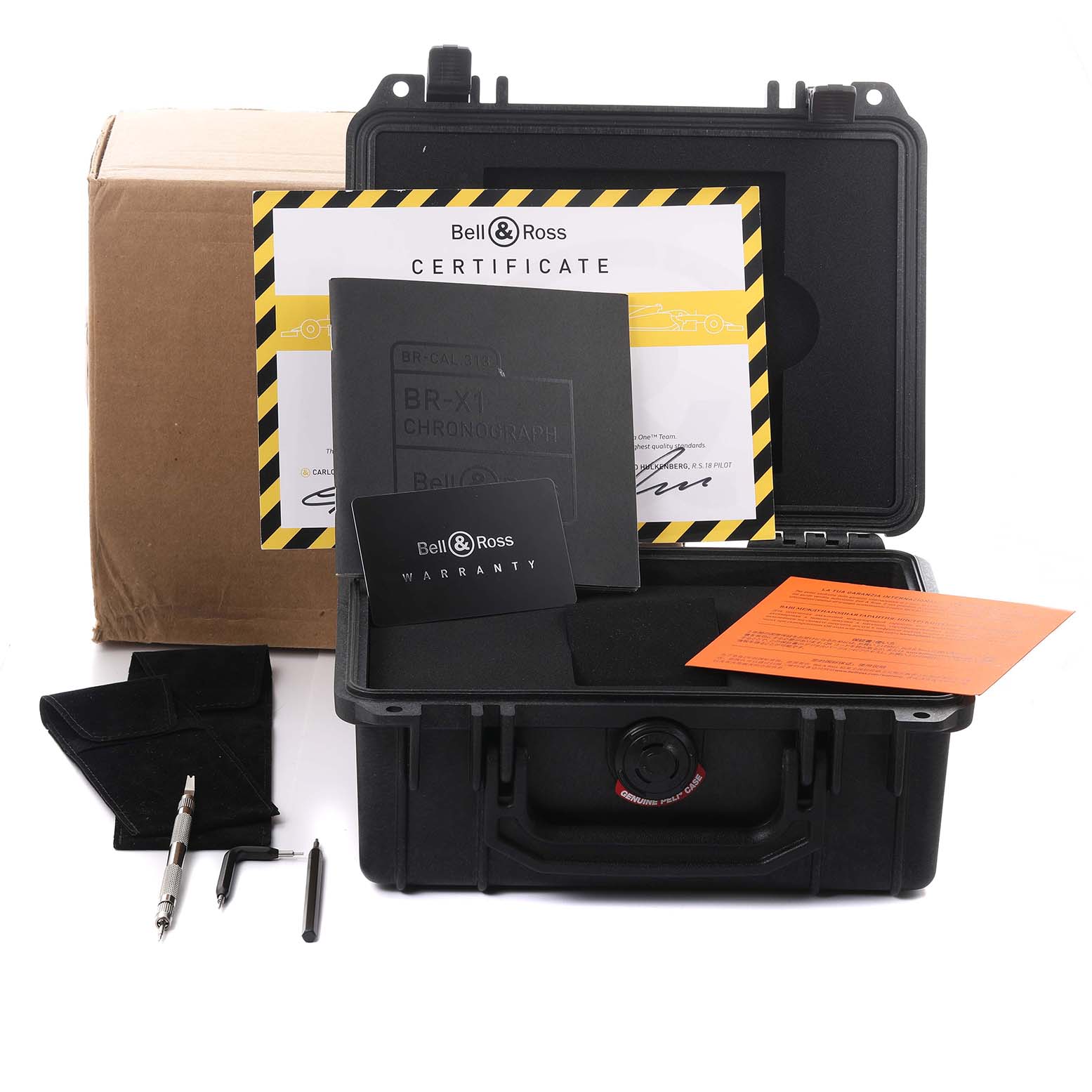 The Bell 
Ross Instruments BR-X1 R.S.18 Men
s Titanium Transparent Dial BR-X1 R.S.18 Men
s Titanium Transparent Dial watch accessories are shown from the front, including a case, documents, and tools.