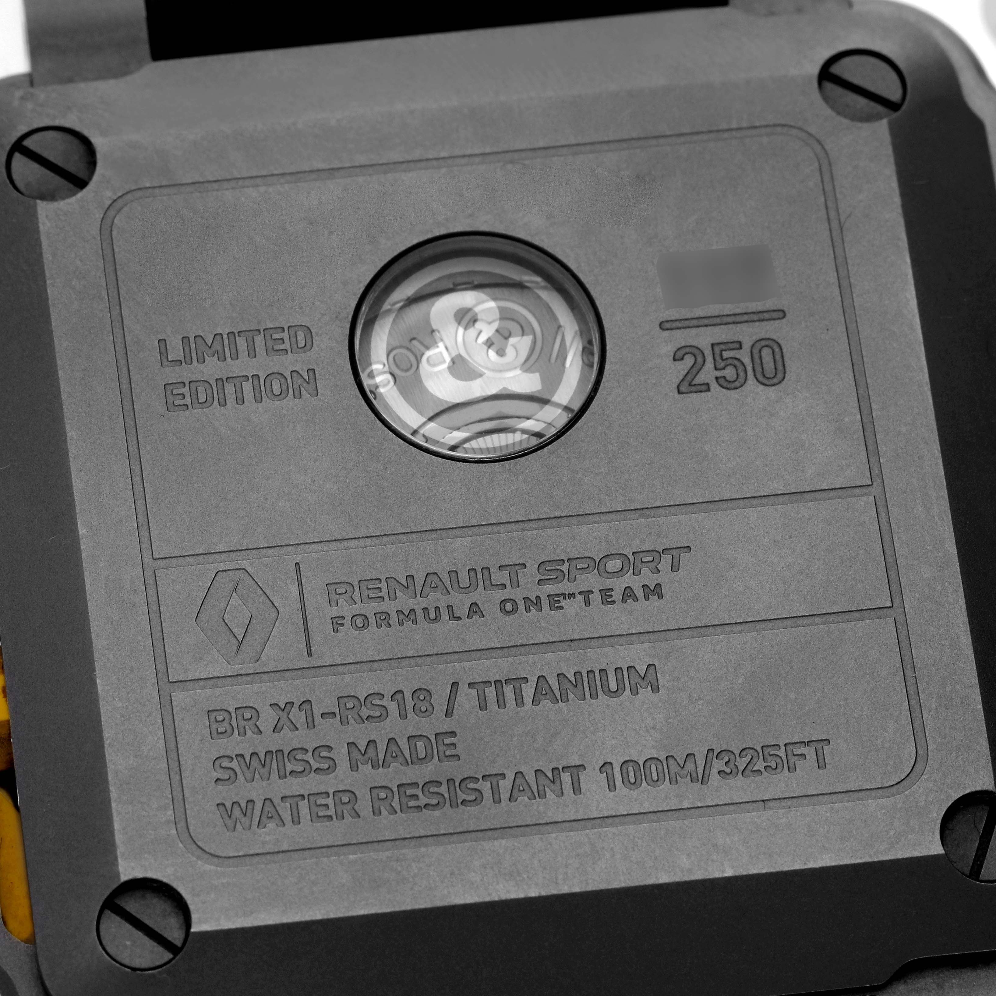 The image shows the back casing of the Bell 
Ross Instruments BR-X1 R.S.18 Men
s Titanium Transparent Dial BR-X1 R.S.18 Men
s Titanium Transparent Dial model watch, highlighting its limited edition details.