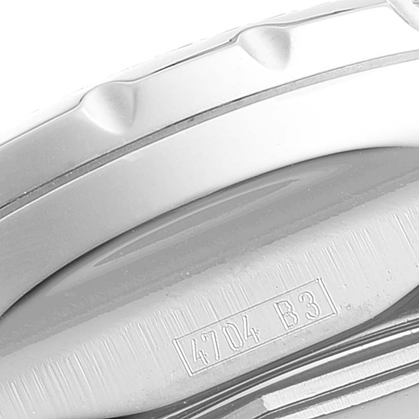 The image shows the side view of the bezel and part of the case of a Breitling Bentley D13362 Men's Steel and Gold (two tone) Blue Dial D13362 Men's Steel and Gold (two tone) Blue Dial watch, along with an inscribed serial or model number.