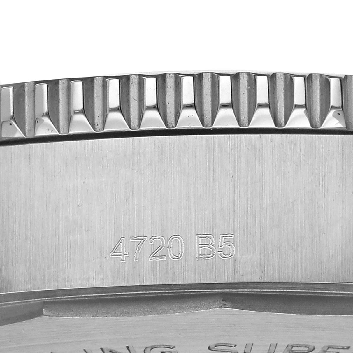 The image shows a close-up of the edge and part of the engraved casing of a Breitling Superocean A17366 Men
s Stainless Steel Black Dial A17366 Men
s Stainless Steel Black Dial watch.