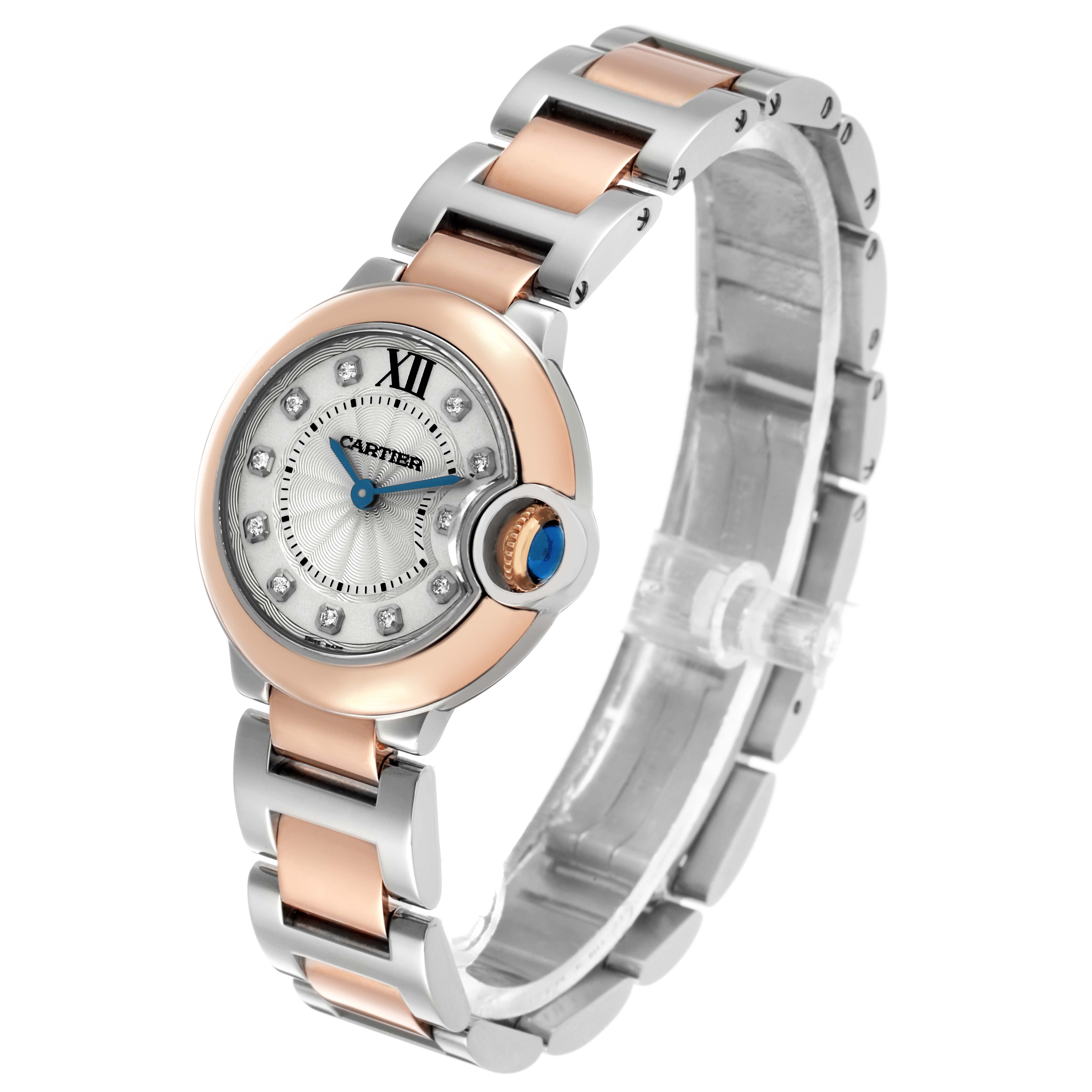 The Cartier Ballon Bleu W3BB0005 Women's Steel and Gold (two tone) Silver Dial watch is shown at an angle highlighting the rose gold and silver bracelet, bezel, and crown with a blue cabochon.