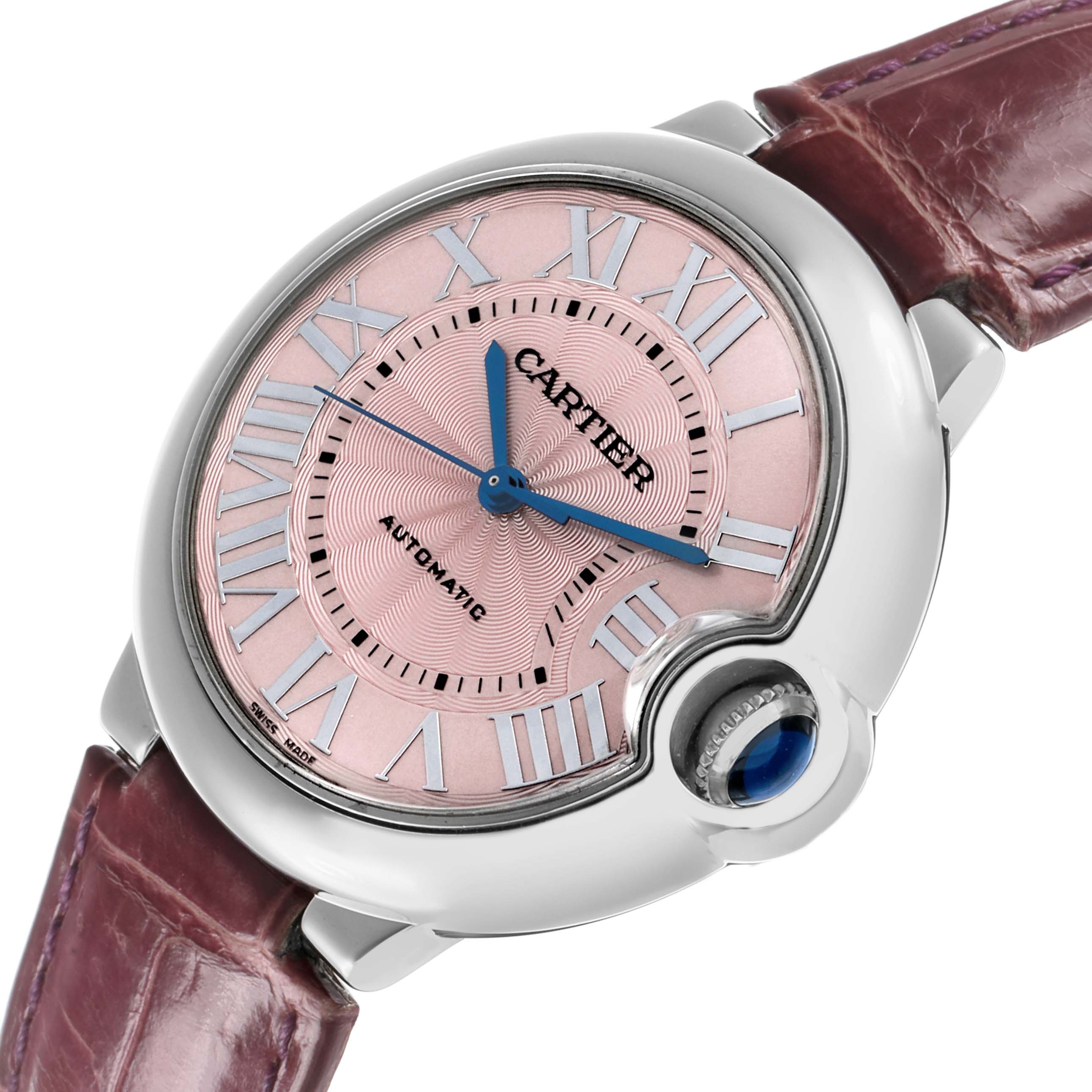 The Cartier Ballon Bleu WSBB0007 Women's Stainless Steel Pink Dial watch is shown at an angled top view, highlighting its face, Roman numerals, and signature cabochon crown.