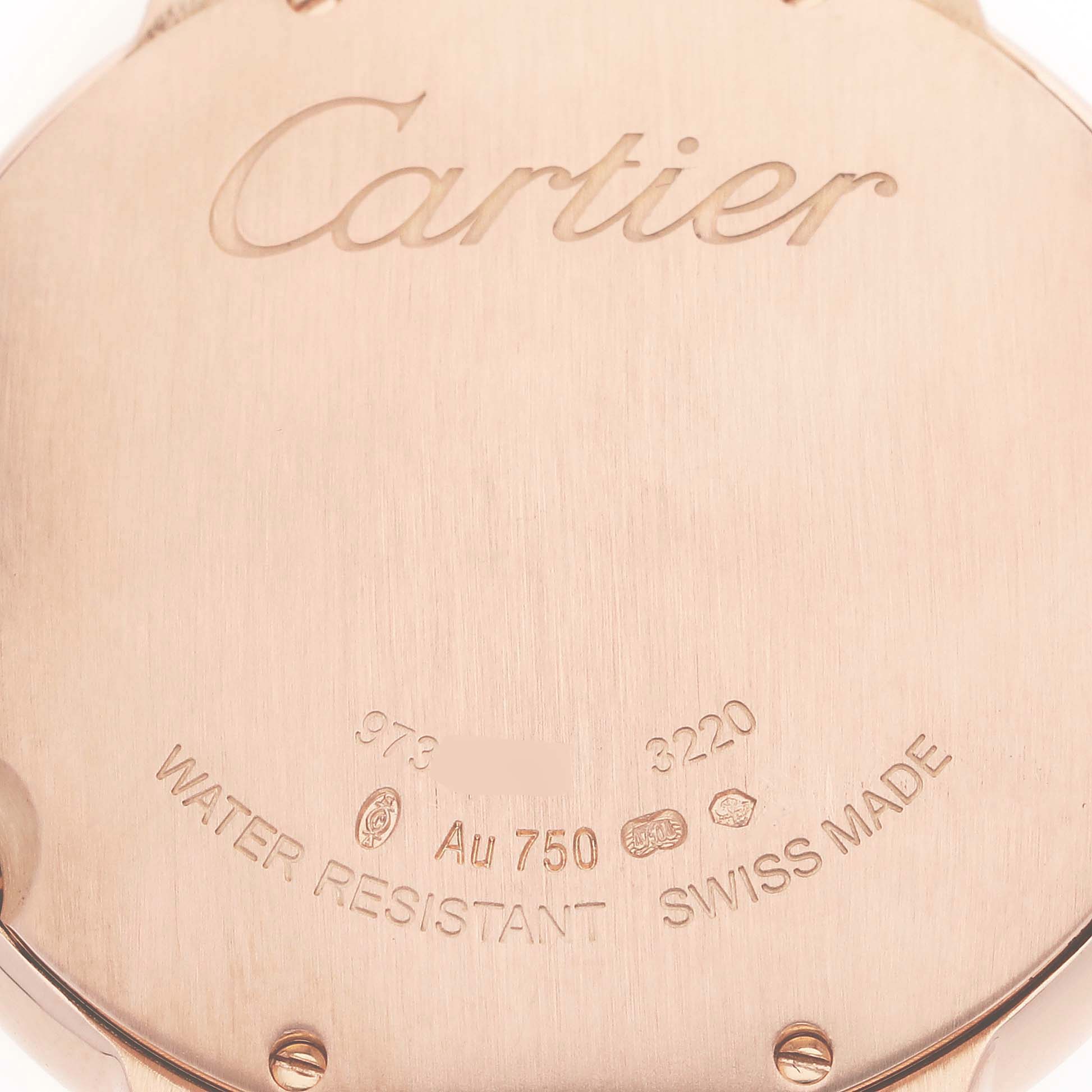The image shows the back of a Cartier Ballon Bleu WE902018 Women's Rose Gold Mother of Pearl Dial watch, highlighting engravings and hallmarks.