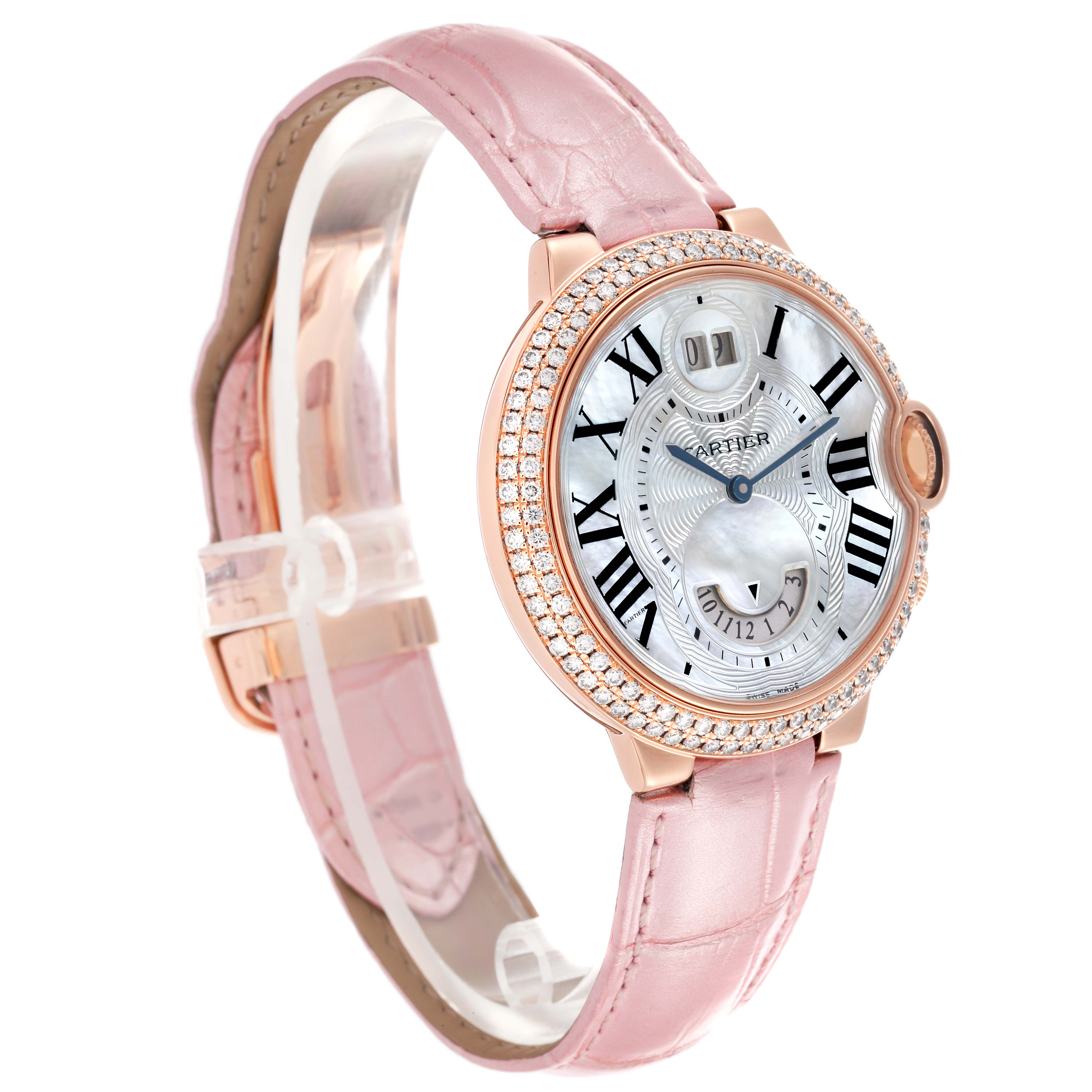 The Cartier Ballon Bleu WE902018 Women's Rose Gold Mother of Pearl Dial WE902018 Women's Rose Gold Mother of Pearl Dial watch is shown from a side angle, highlighting the face, bezel, and pink leather strap.