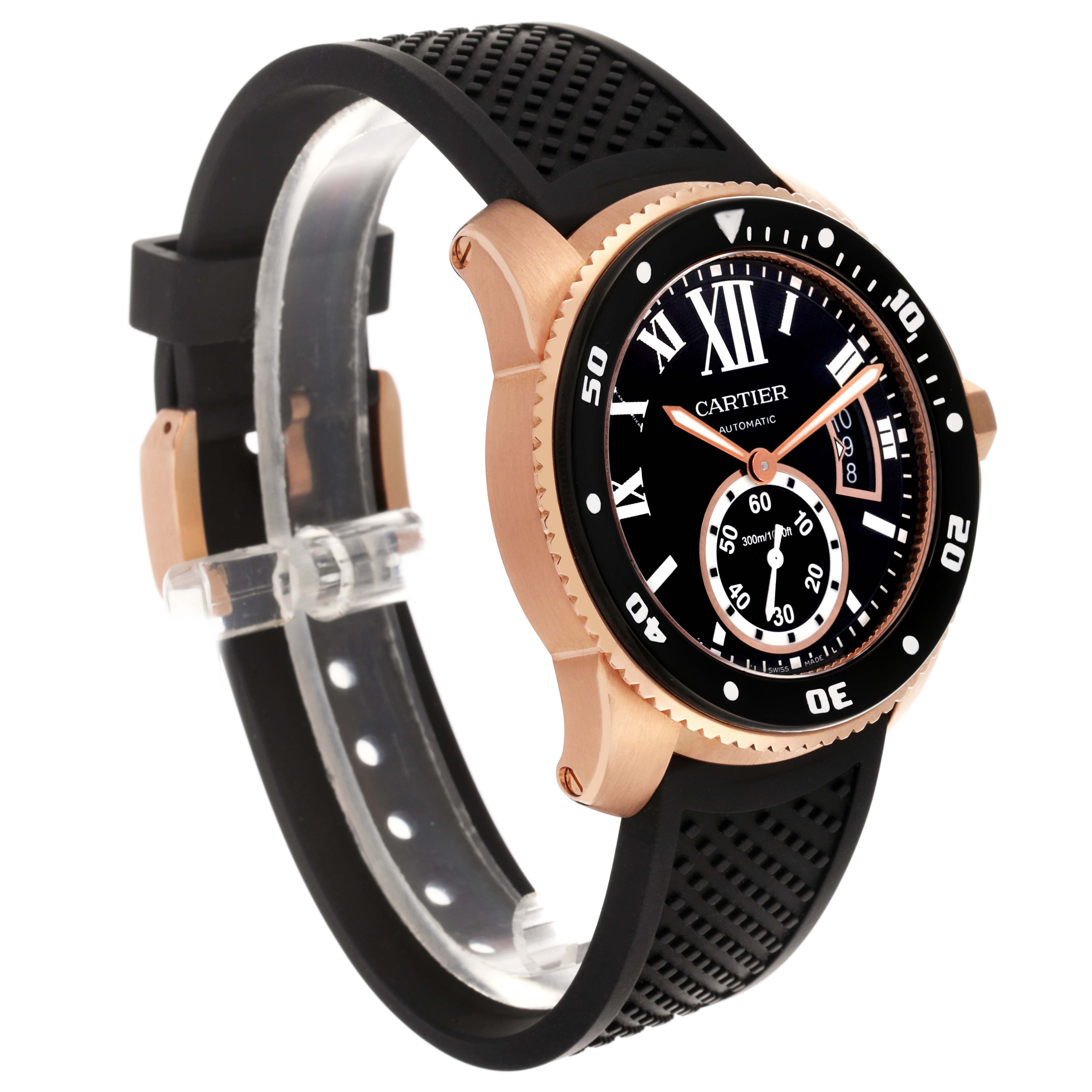 The image shows a Calibre de Cartier watch at a three-quarter angle, highlighting the case, bezel, dial, and rubber strap.