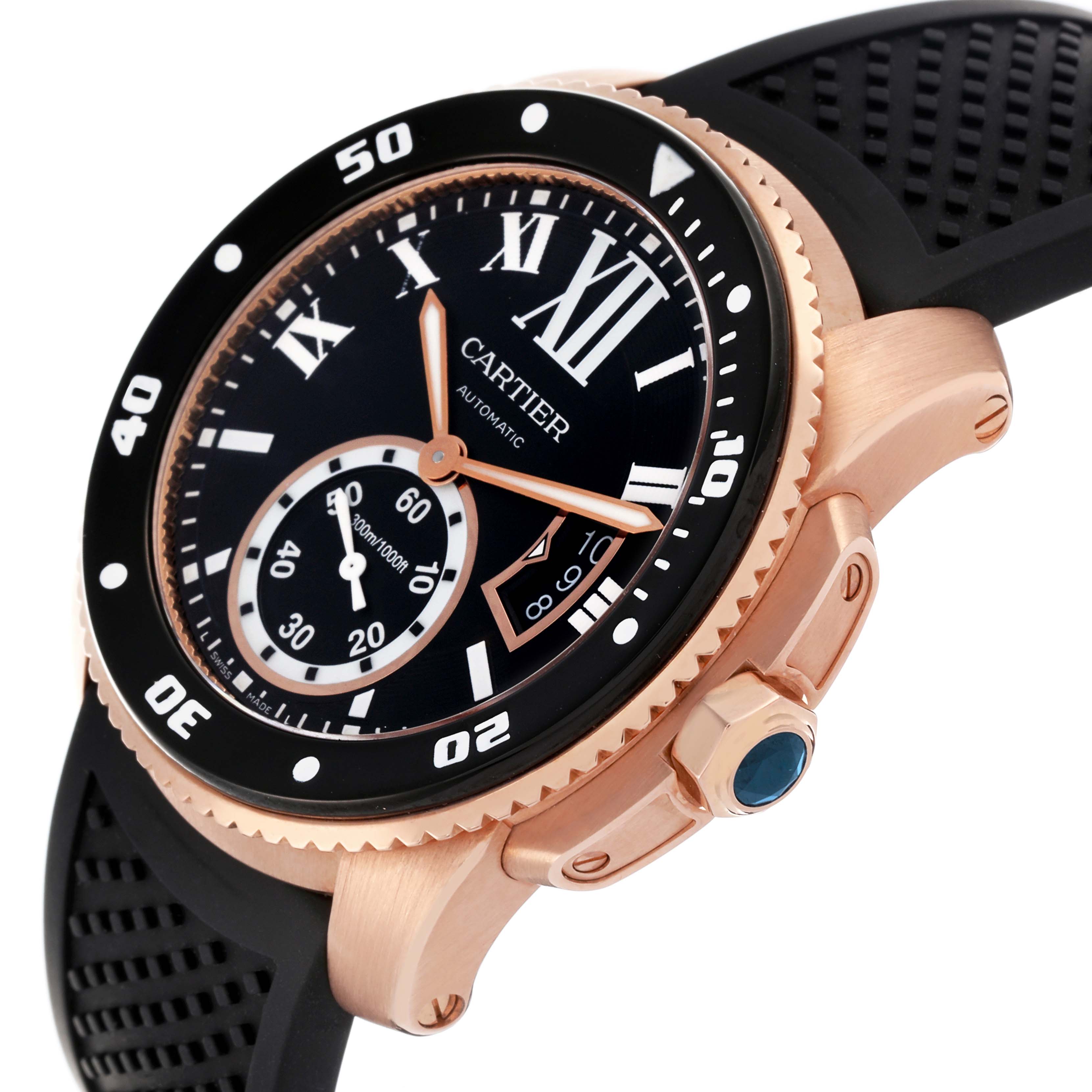 The Calibre de Cartier watch is shown at an angle highlighting the case, bezel, crown, strap, and dial with a rose gold tone.