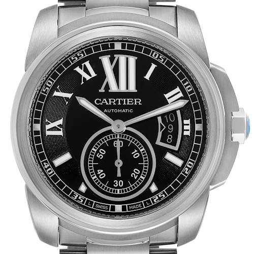 The image shows a frontal view of the Calibre de Cartier watch, highlighting the full dial and metal bracelet.