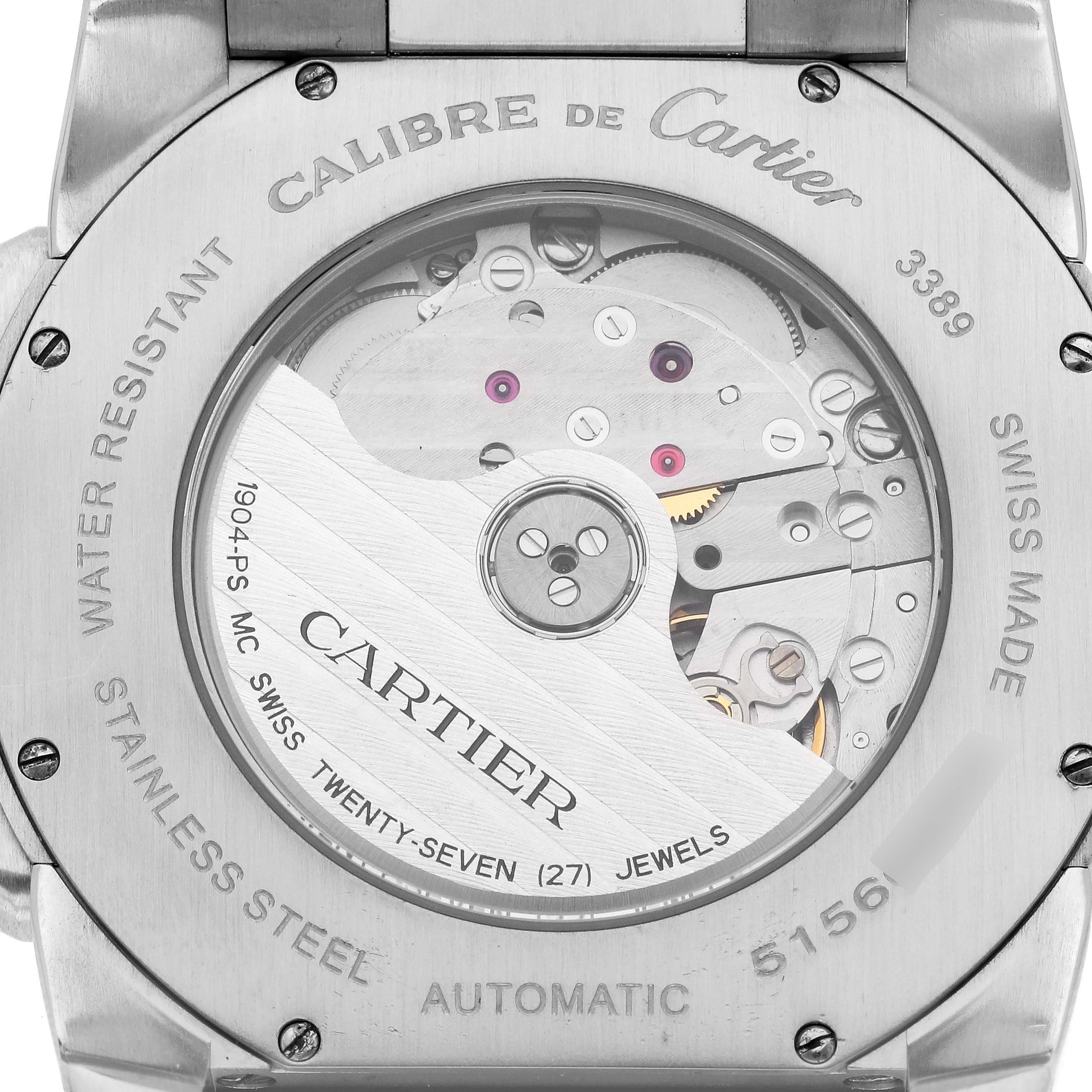 The image shows the back of the Calibre de Cartier watch, highlighting its automatic movement and engravings.