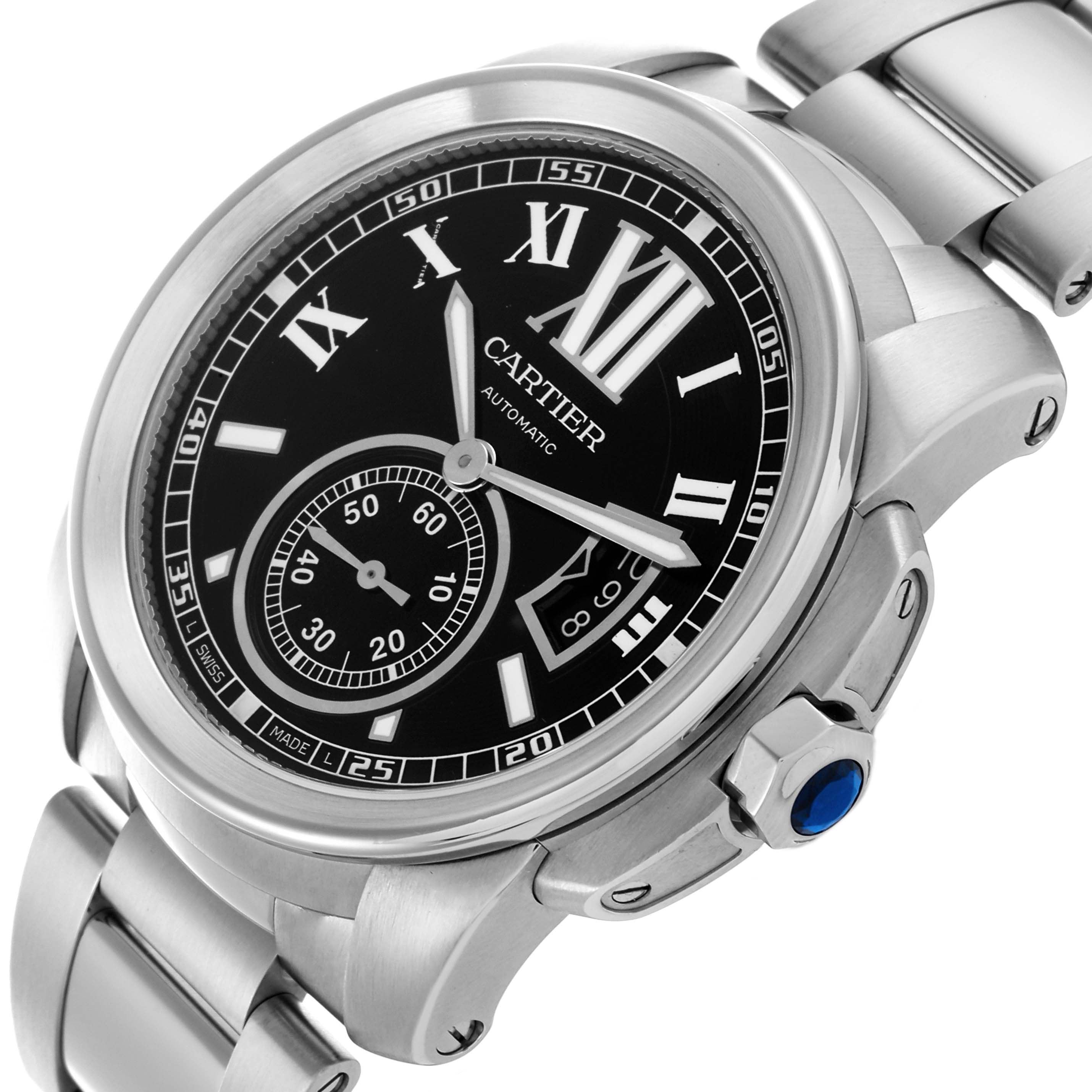 The Calibre de Cartier watch by Cartier is shown from an angled top view, highlighting the black dial, Roman numerals, and metal bracelet.