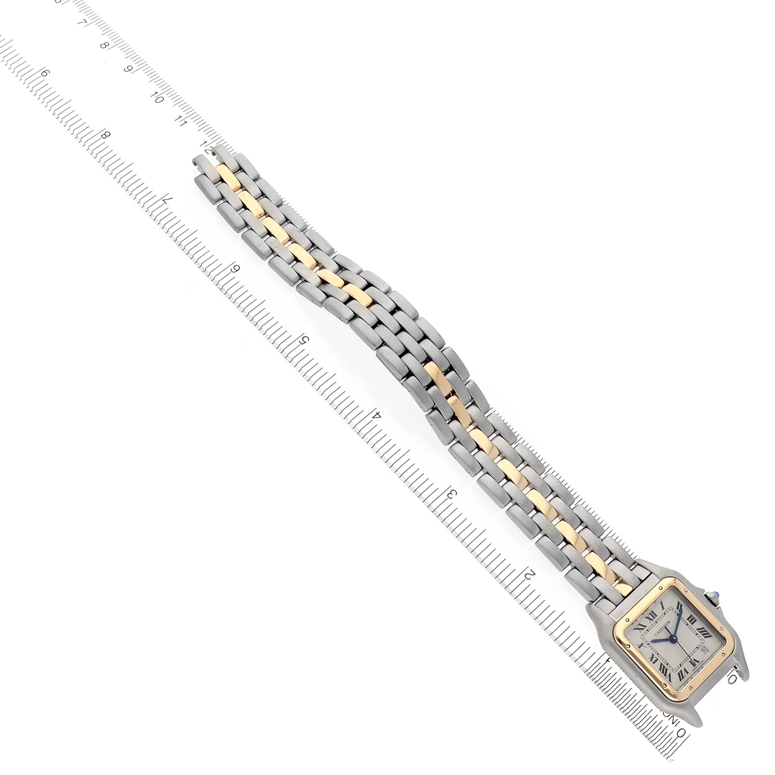 The Cartier Panthere W25028B5 Women's Steel and Gold (two tone) Silver Dial W25028B5 Women's Steel and Gold (two tone) Silver Dial watch is shown diagonally with its face and full two-tone bracelet visible along a ruler.