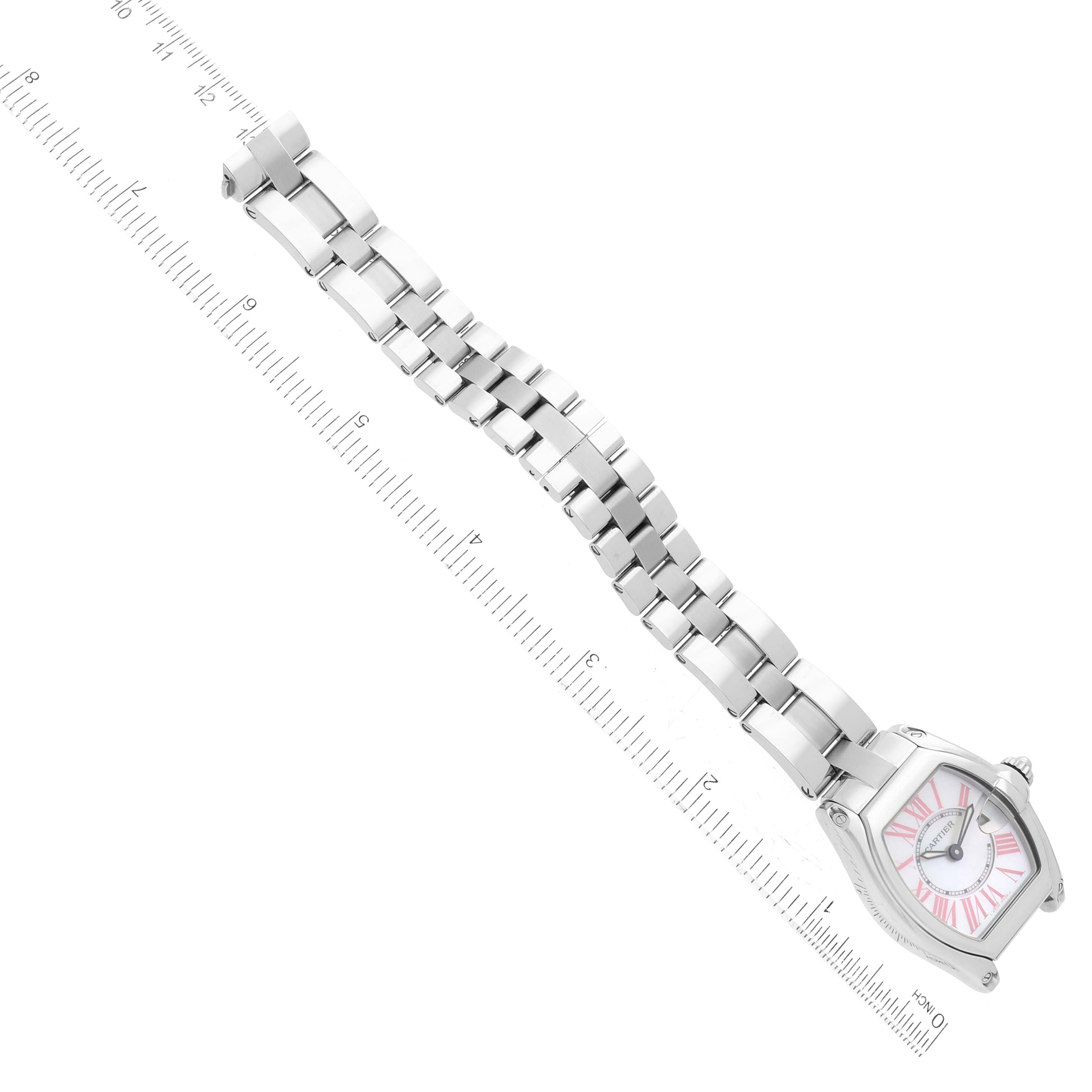 This image shows a Cartier Roadster W6206006 Women's Stainless Steel Mother of Pearl Dial W6206006 Women's Stainless Steel Mother of Pearl Dial watch laid flat, emphasizing its face, bracelet, and clasp with a measuring rule for scale.