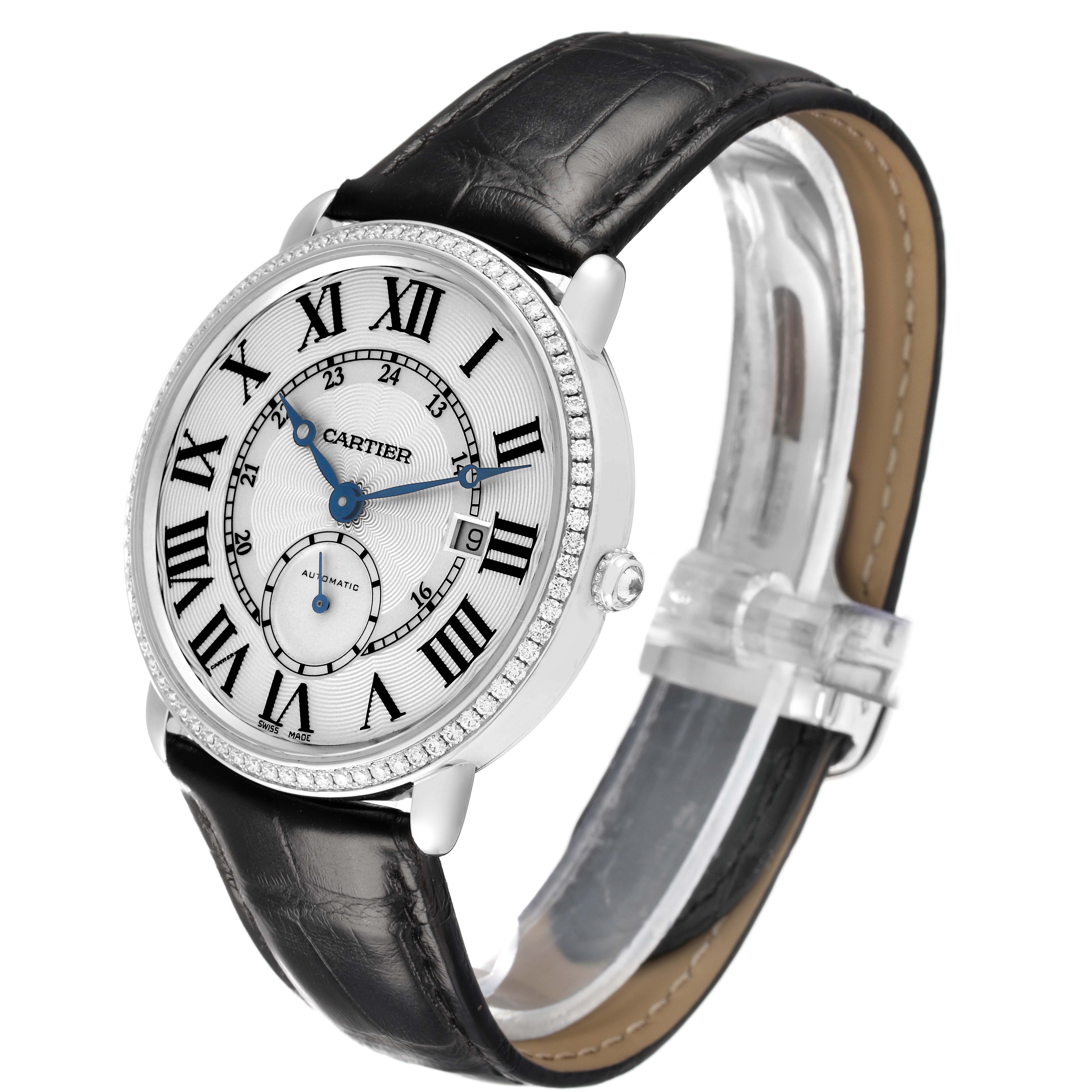 The Cartier Ronde WR007018 Men's White Gold Silver Dial watch is shown at a three-quarter angle, displaying the dial, bezel, crown, and black leather strap.