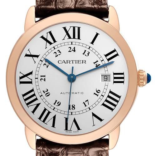 The Cartier Ronde watch is shown from a front angle, displaying the dial, Roman numerals, hands, and crown.