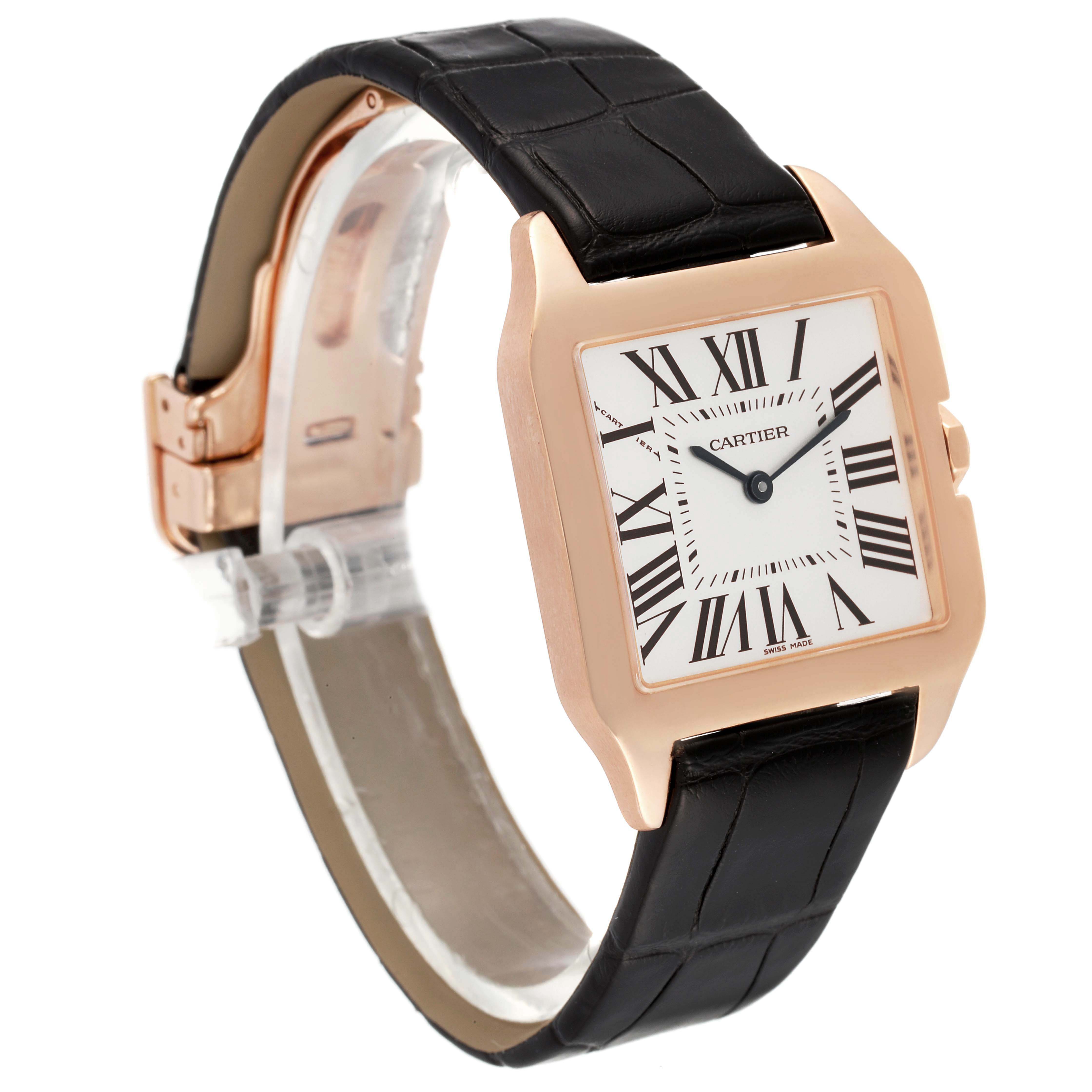 The image shows a Santos Dumont model watch by Cartier at a three-quarter angle, highlighting the face, case, and strap.