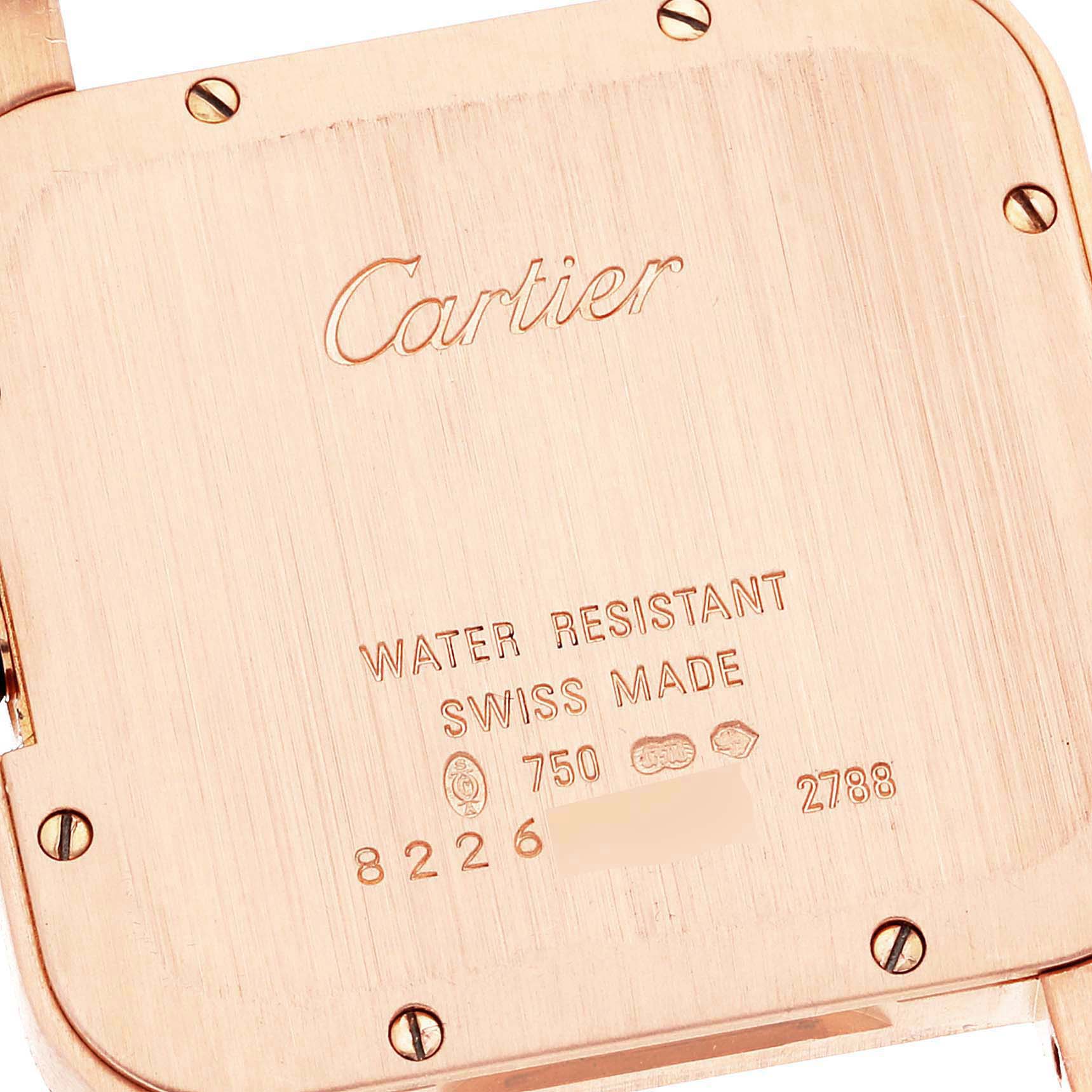 The image shows the back case of a Cartier Santos Dumont W2009251 Men's Rose Gold Silver Dial W2009251 Men's Rose Gold Silver Dial watch, highlighting its water resistance and Swiss made details.