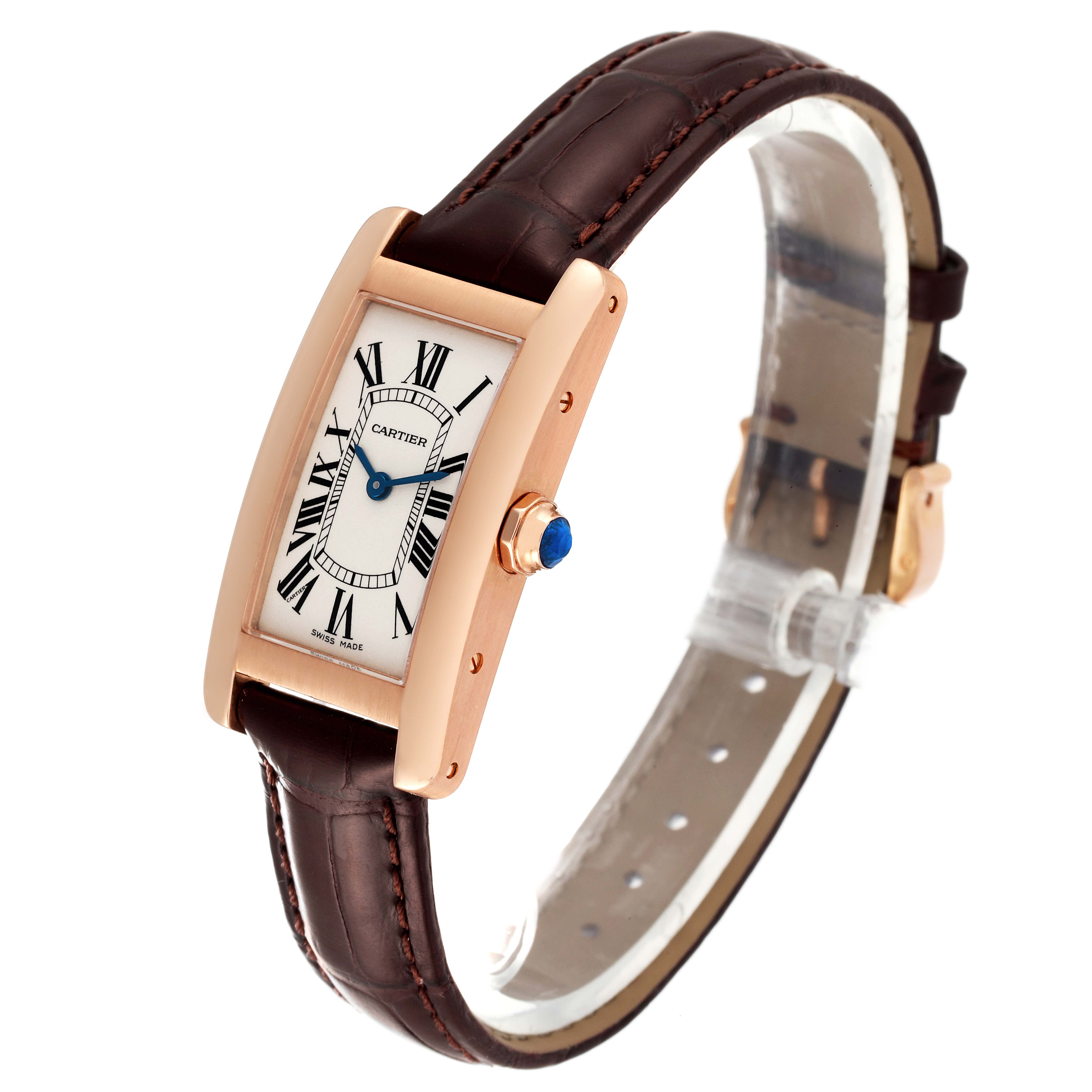 The Tank Américaine model by Cartier is shown at a slight angle, displaying the face, crown, and leather strap.