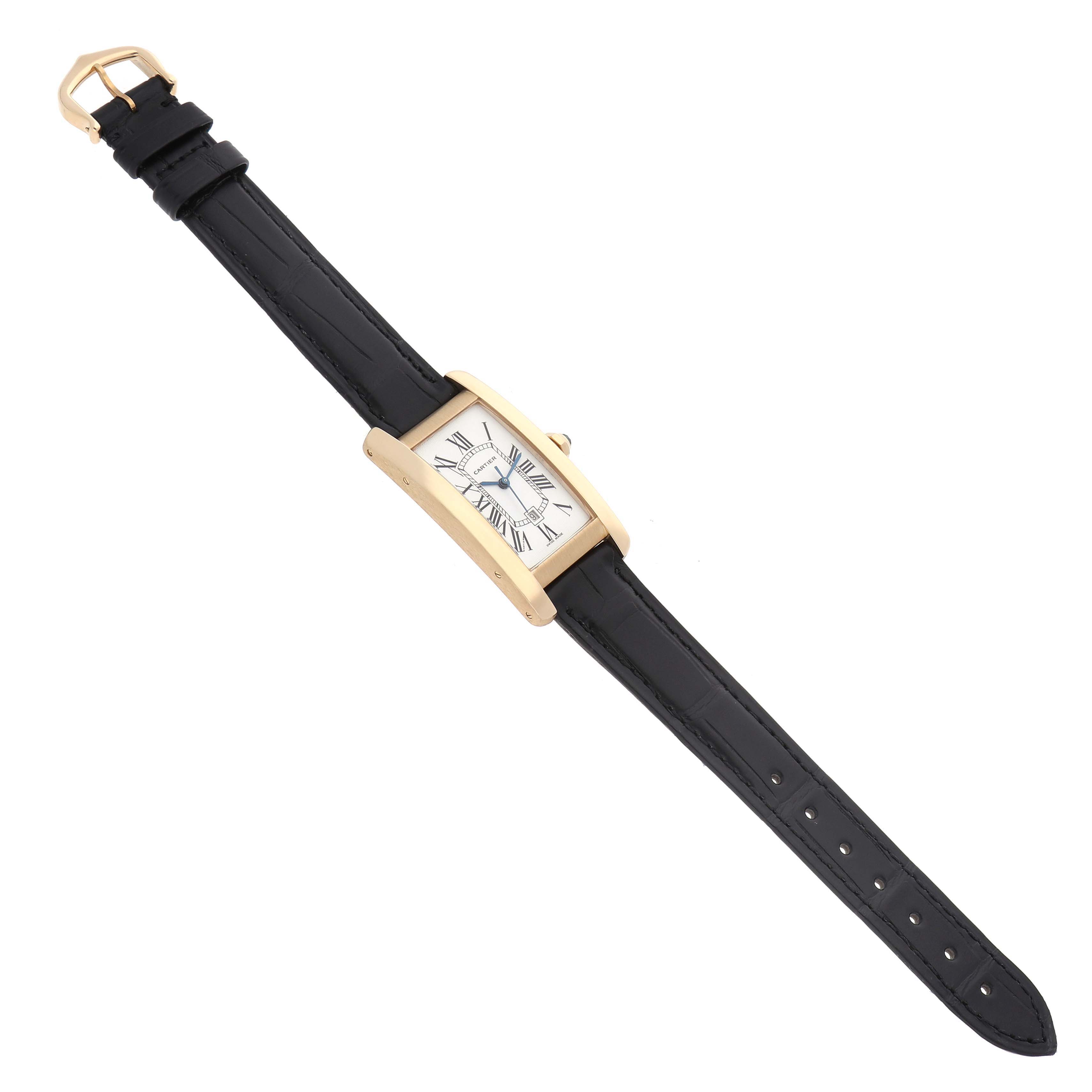 The Cartier Tank Américaine watch is shown from a top angle, highlighting its rectangular case, dial, and leather strap.