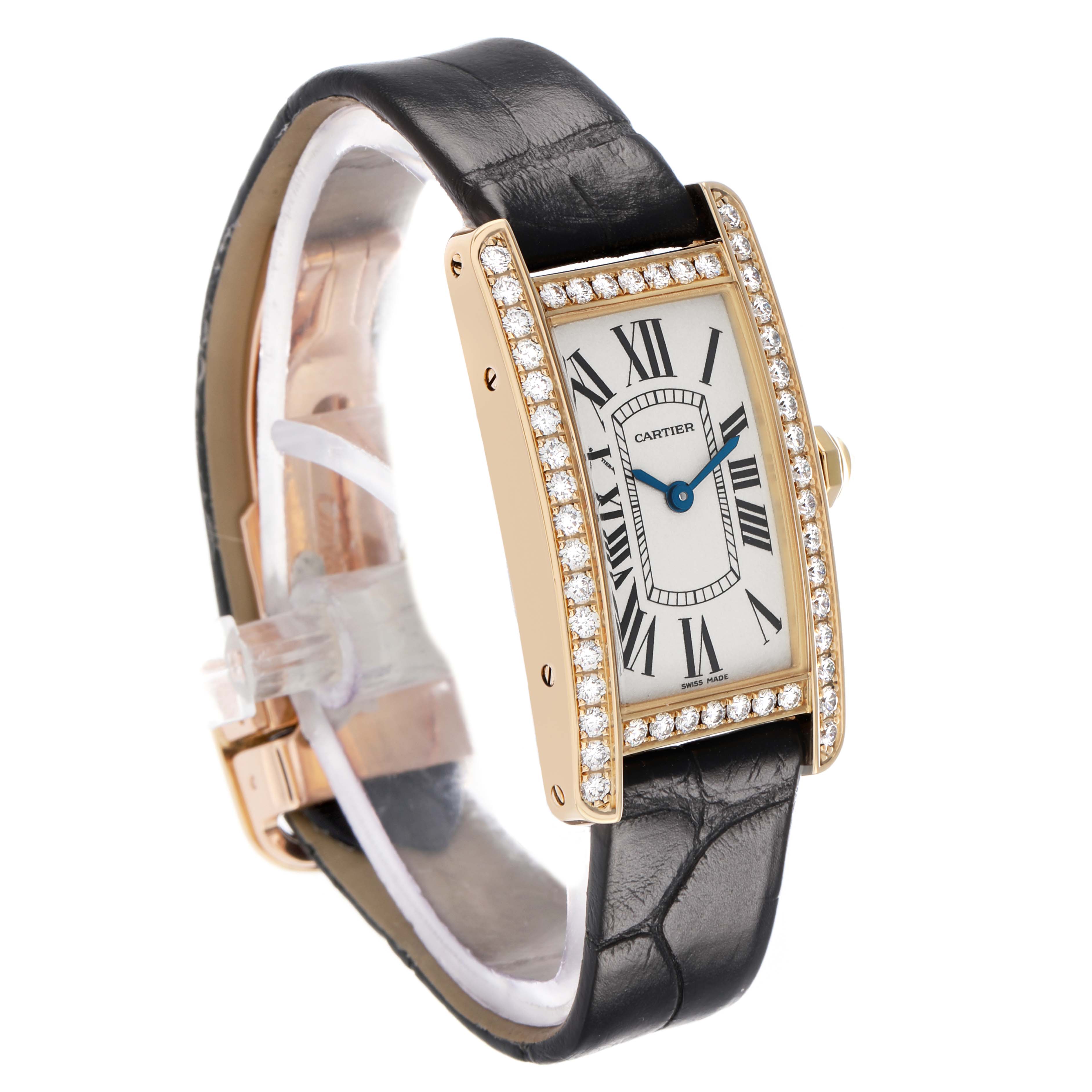 The Cartier Tank Americaine WB707231 Women's Yellow Gold Silver Dial watch is shown in a three-quarter view, highlighting its rectangular face, diamond-set bezel, and leather strap.
