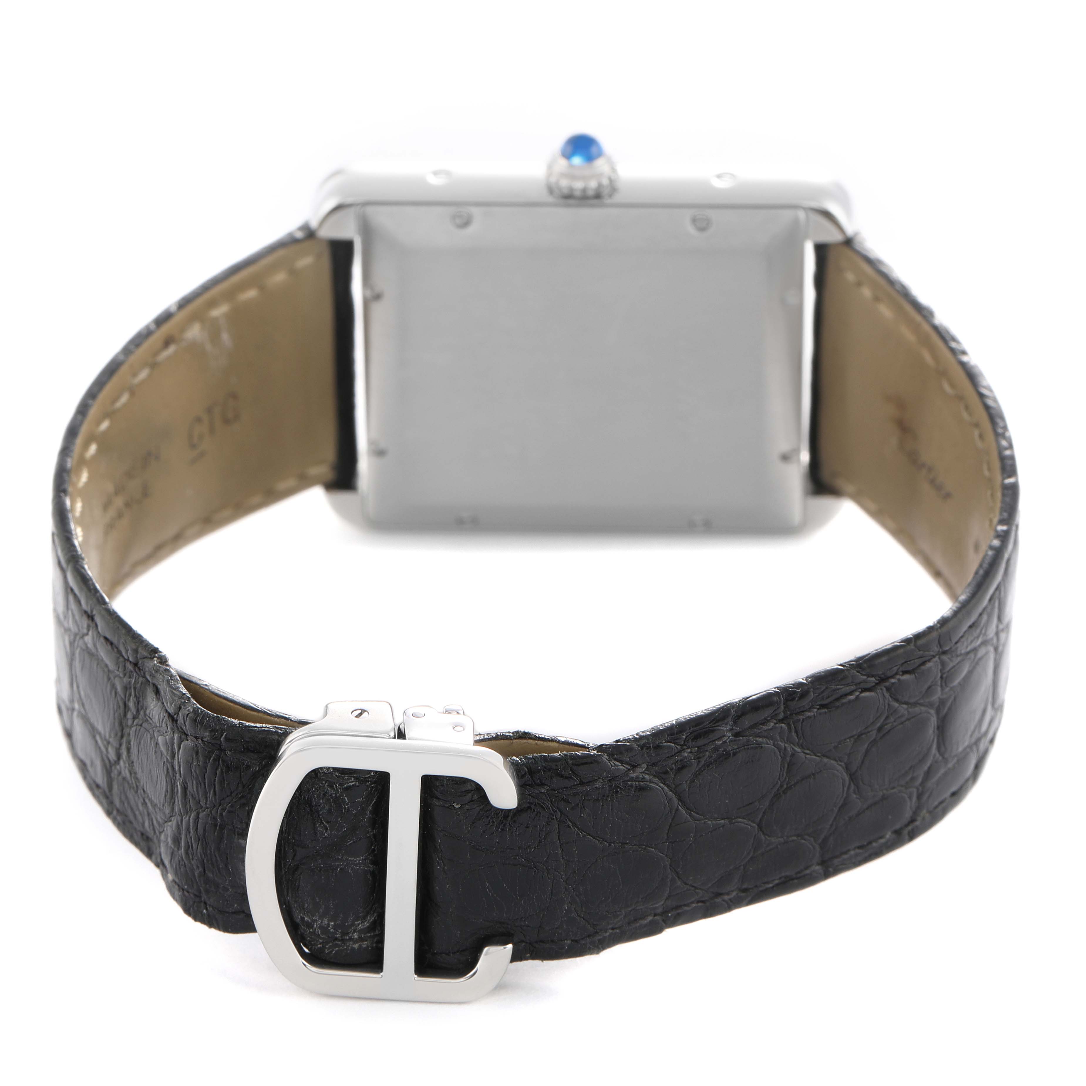 The Cartier Tank Solo W5200027 Men's Stainless Steel Silver Dial watch is shown from the back, highlighting the case, leather strap, and buckle.