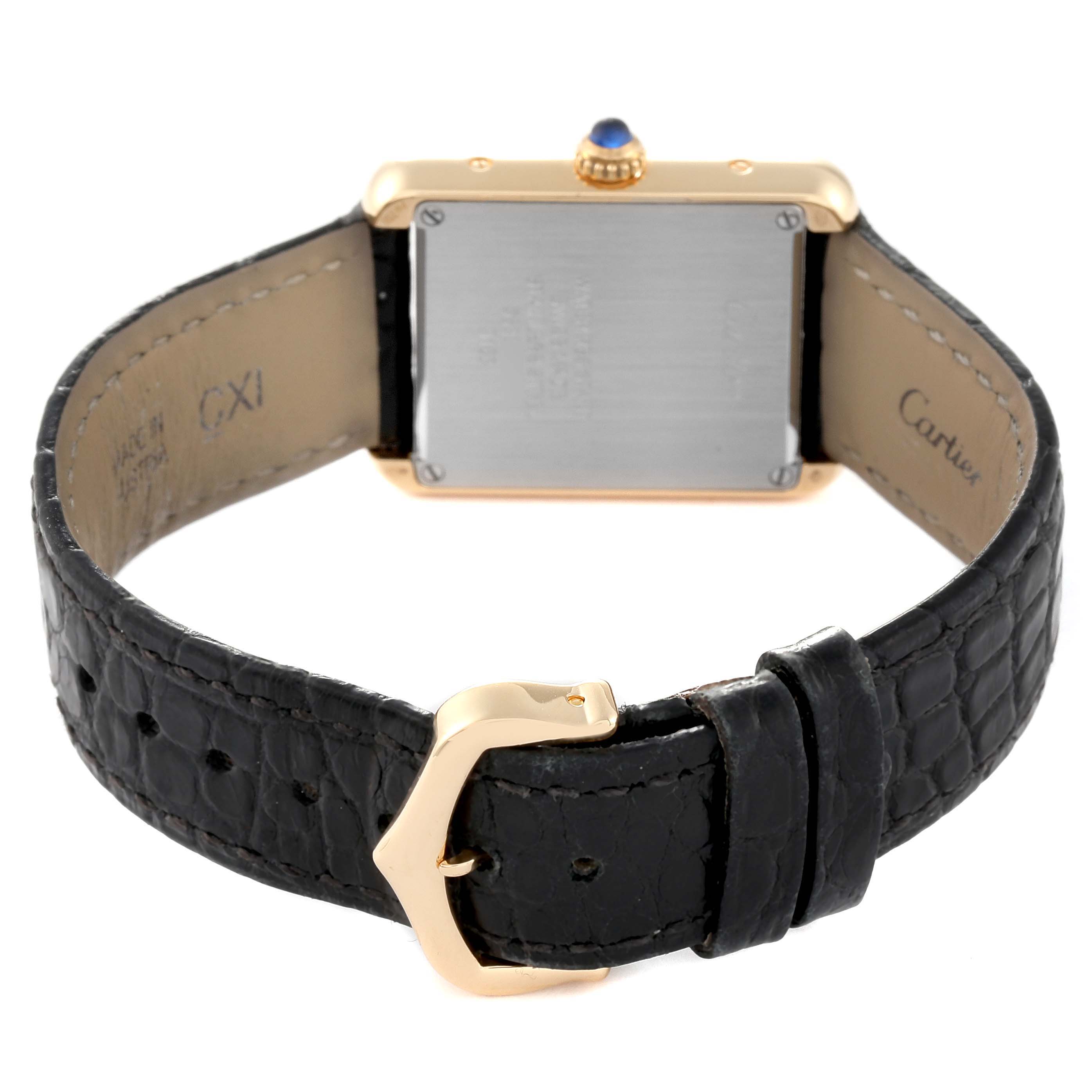 This image shows the back and strap of a Cartier Tank Solo W5200002 Women
s Steel and Gold (two tone) Silver Dial W5200002 Women
s Steel and Gold (two tone) Silver Dial watch, featuring a black leather band and rectangular gold case.