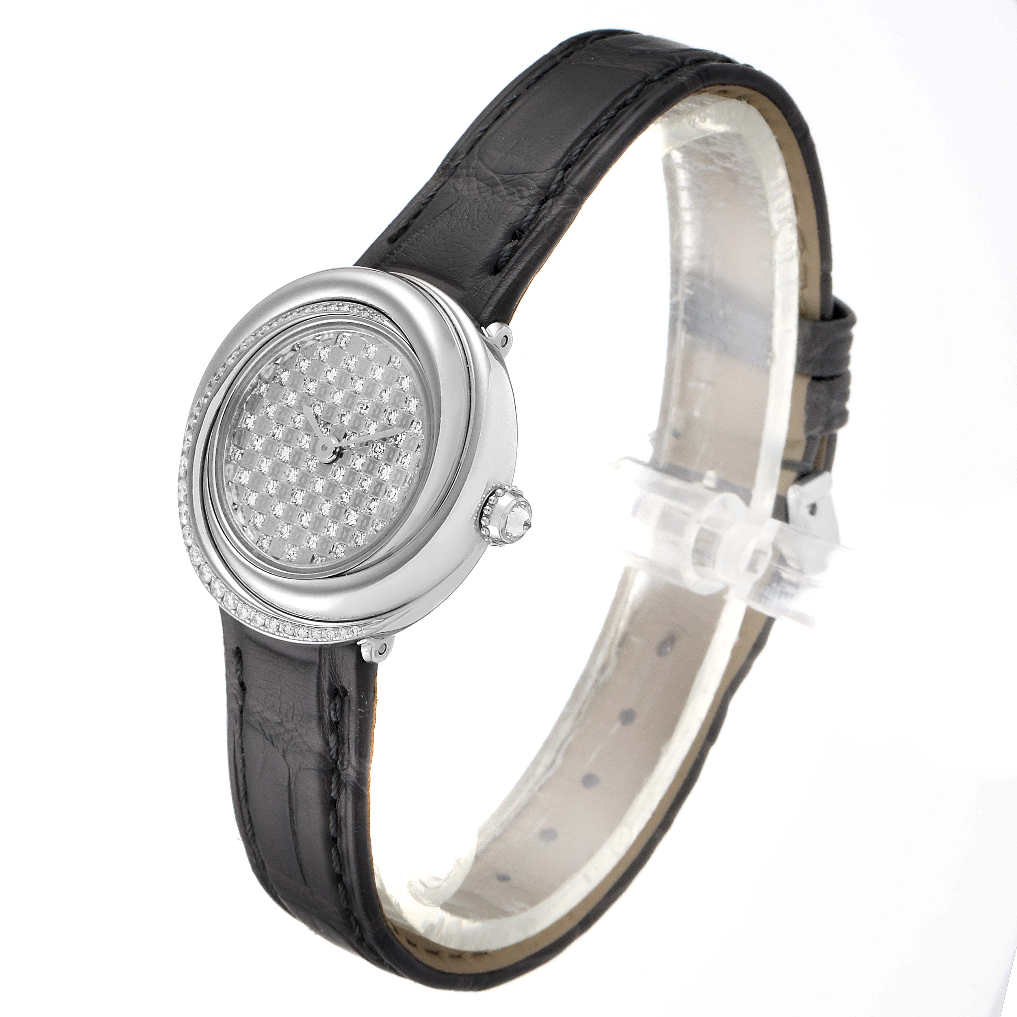 The image shows a Cartier Trinity 2444 Women's White Gold Silver Dial 2444 Women's White Gold Silver Dial watch captured from a front angle, displaying its round face, diamond embellishments, and black strap.