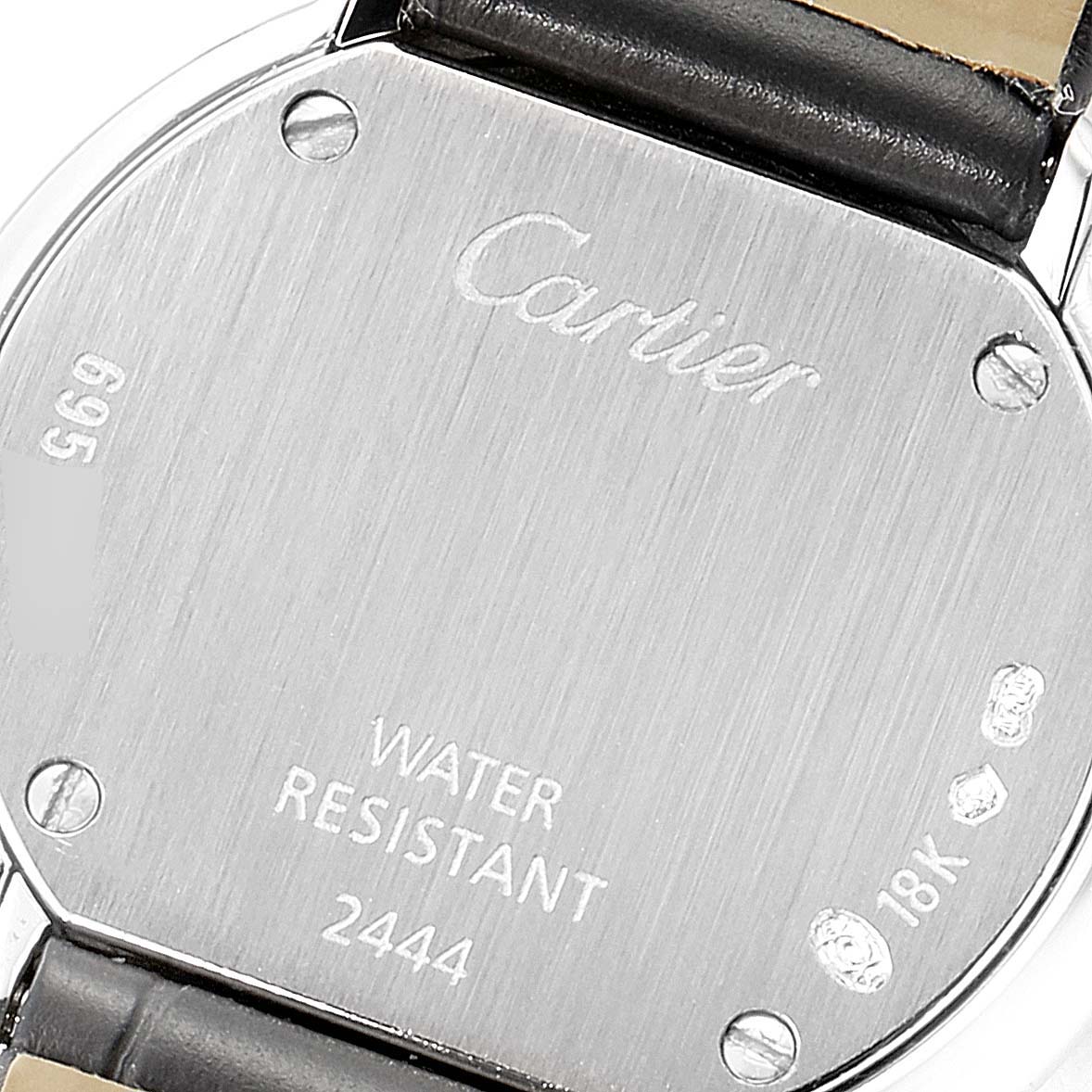 The image shows the back casing of a Cartier Trinity 2444 Women's White Gold Silver Dial 2444 Women's White Gold Silver Dial watch, highlighting its water resistance and 18K markings.