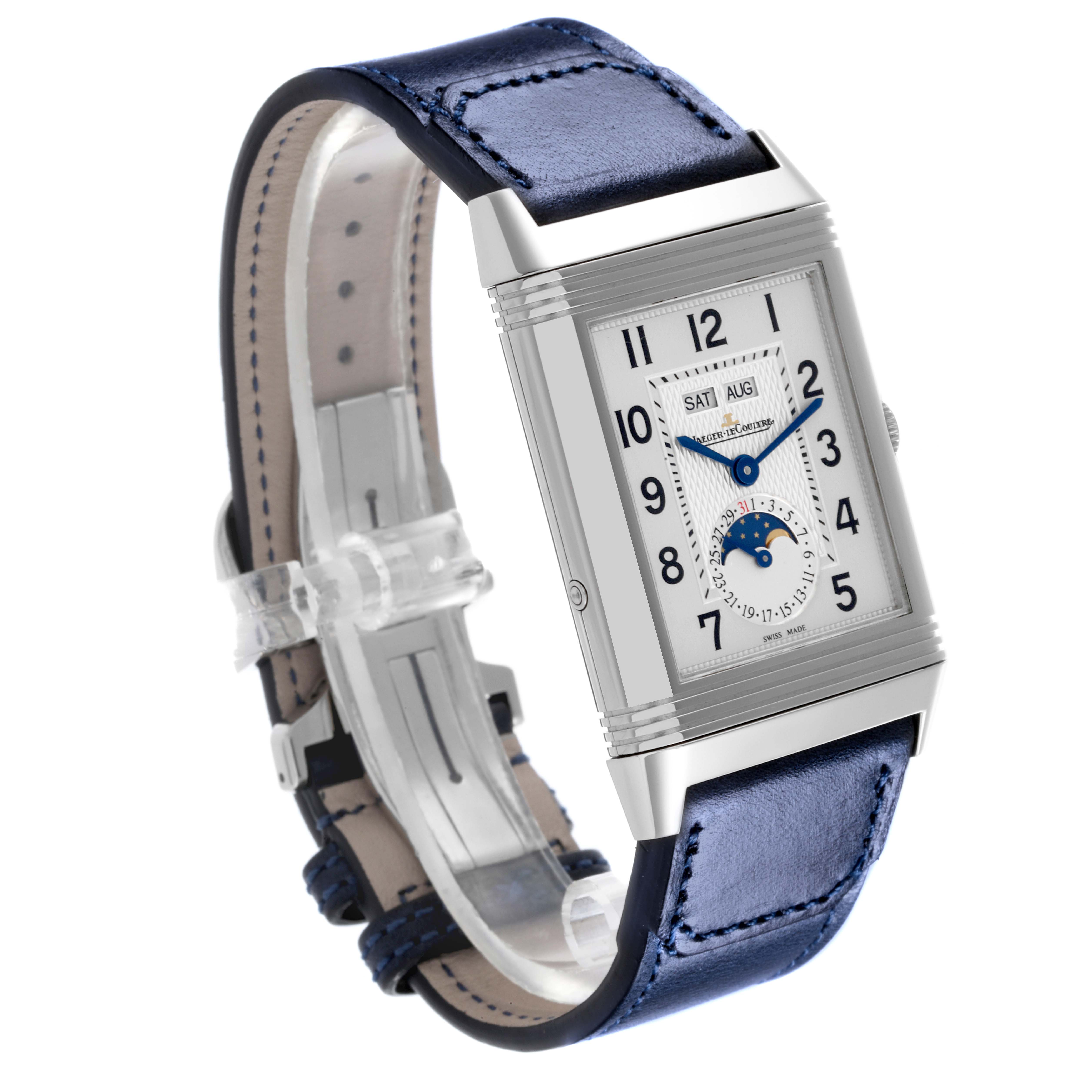 The Jaeger-LeCoultre Reverso watch is shown at a three-quarter angle, highlighting the face and blue leather strap.