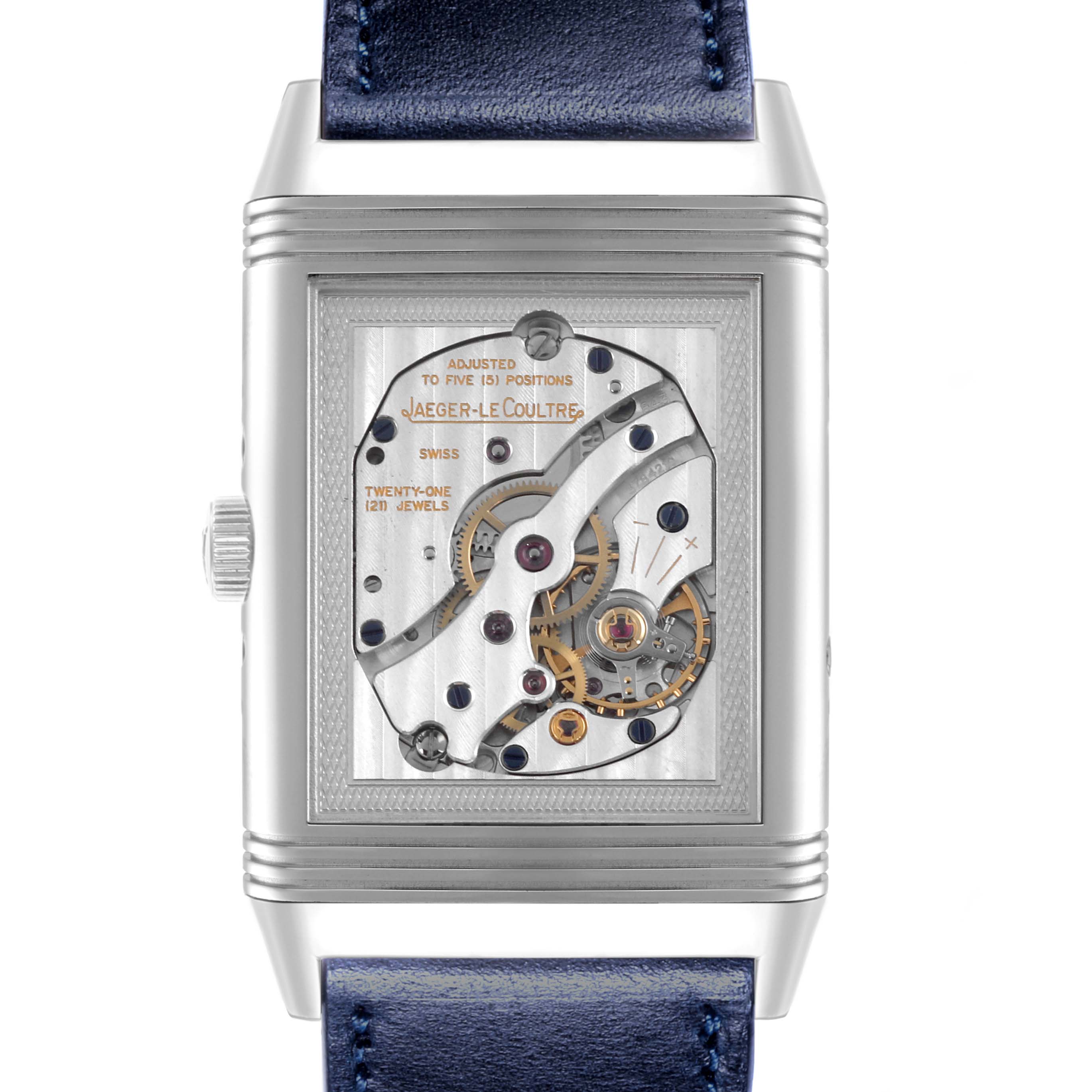 The image shows the reverse side of the Jaeger-LeCoultre Reverso, displaying its movement and mechanical components.