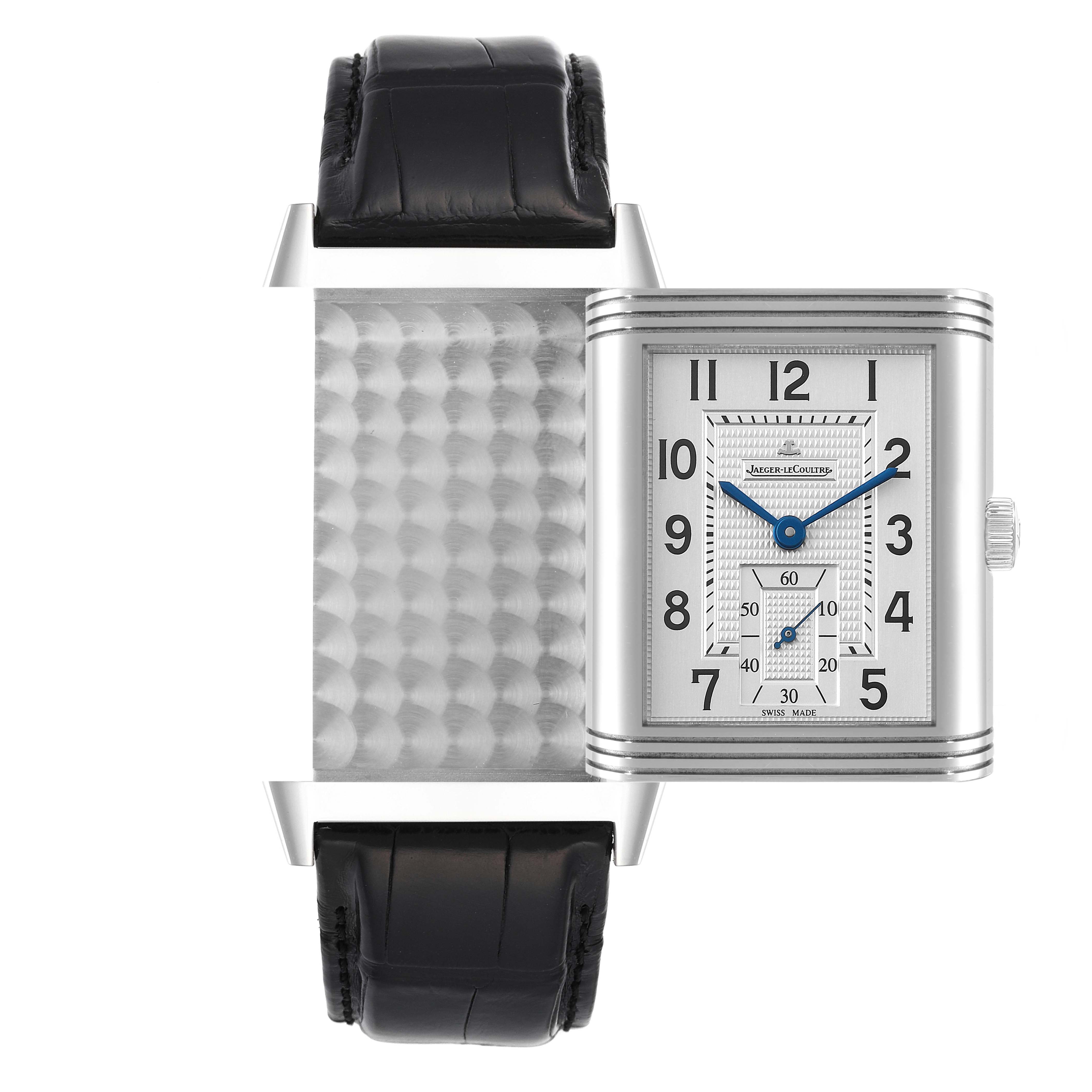 This image shows the Jaeger LeCoultre Reverso Q3738420 Men
s Stainless Steel Silver Dial Q3738420 Men
s Stainless Steel Silver Dial watch at an angle displaying its reversible case and black leather strap.