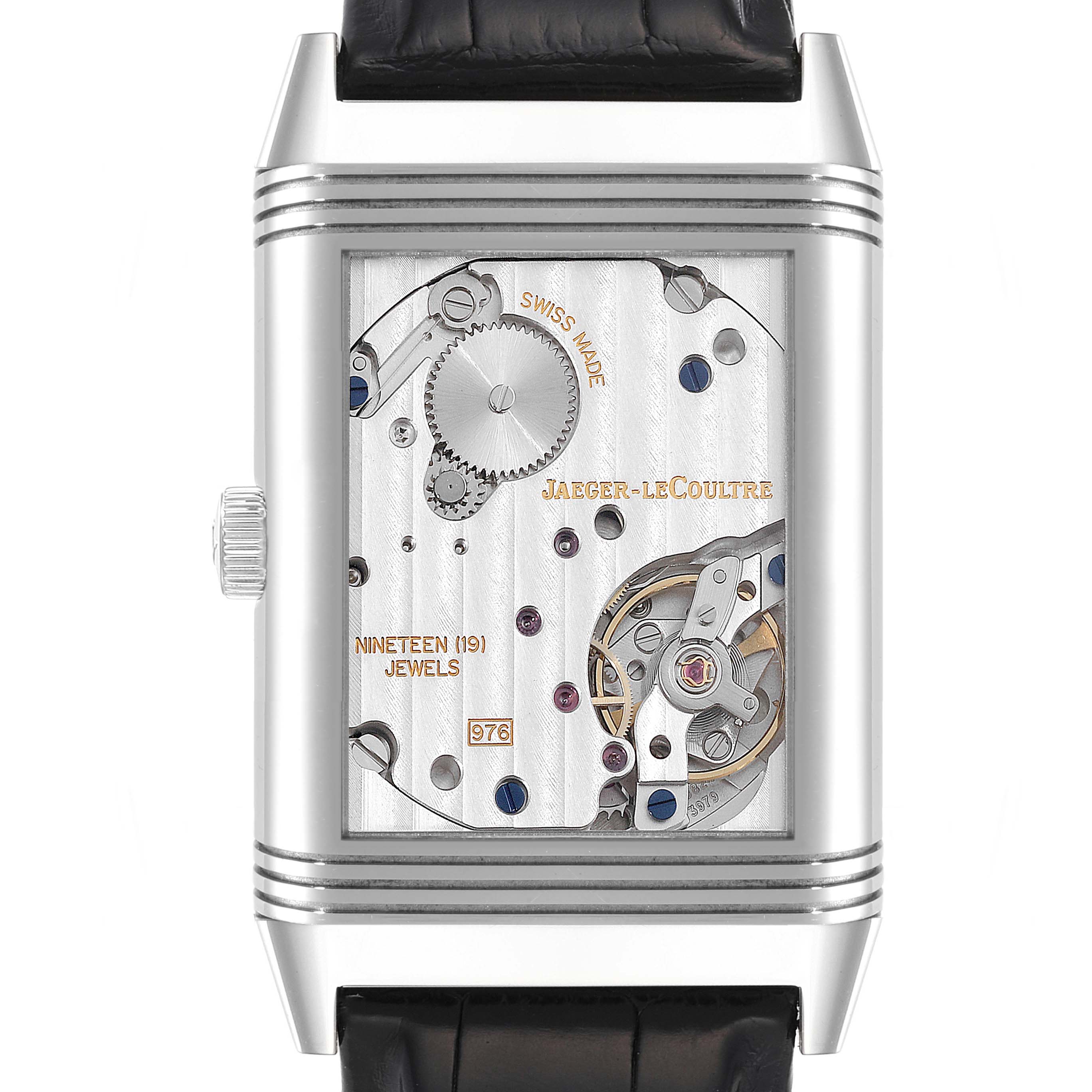 This image shows the back view of a Jaeger-LeCoultre Reverso watch, highlighting its intricate movement and mechanical parts.