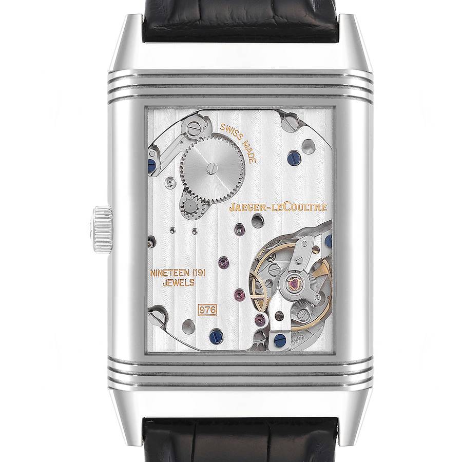 This image shows the back view of a Jaeger-LeCoultre Reverso watch, highlighting its intricate movement and mechanical parts.