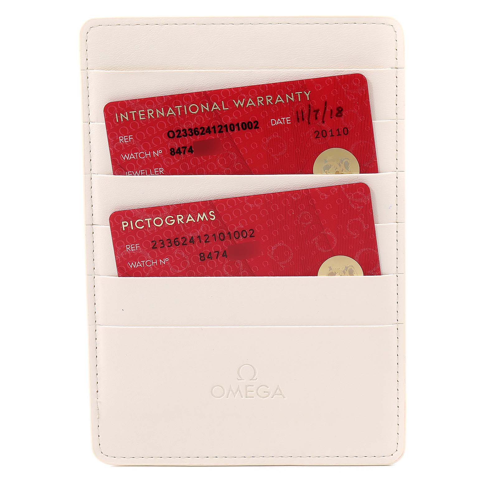 This image shows the International Warranty and Pictograms cards of an Omega Seamaster 233.62.41.21.01.002 Men's Rose Gold Black Dial 233.62.41.21.01.002 Men's Rose Gold Black Dial, displayed in a white holder.