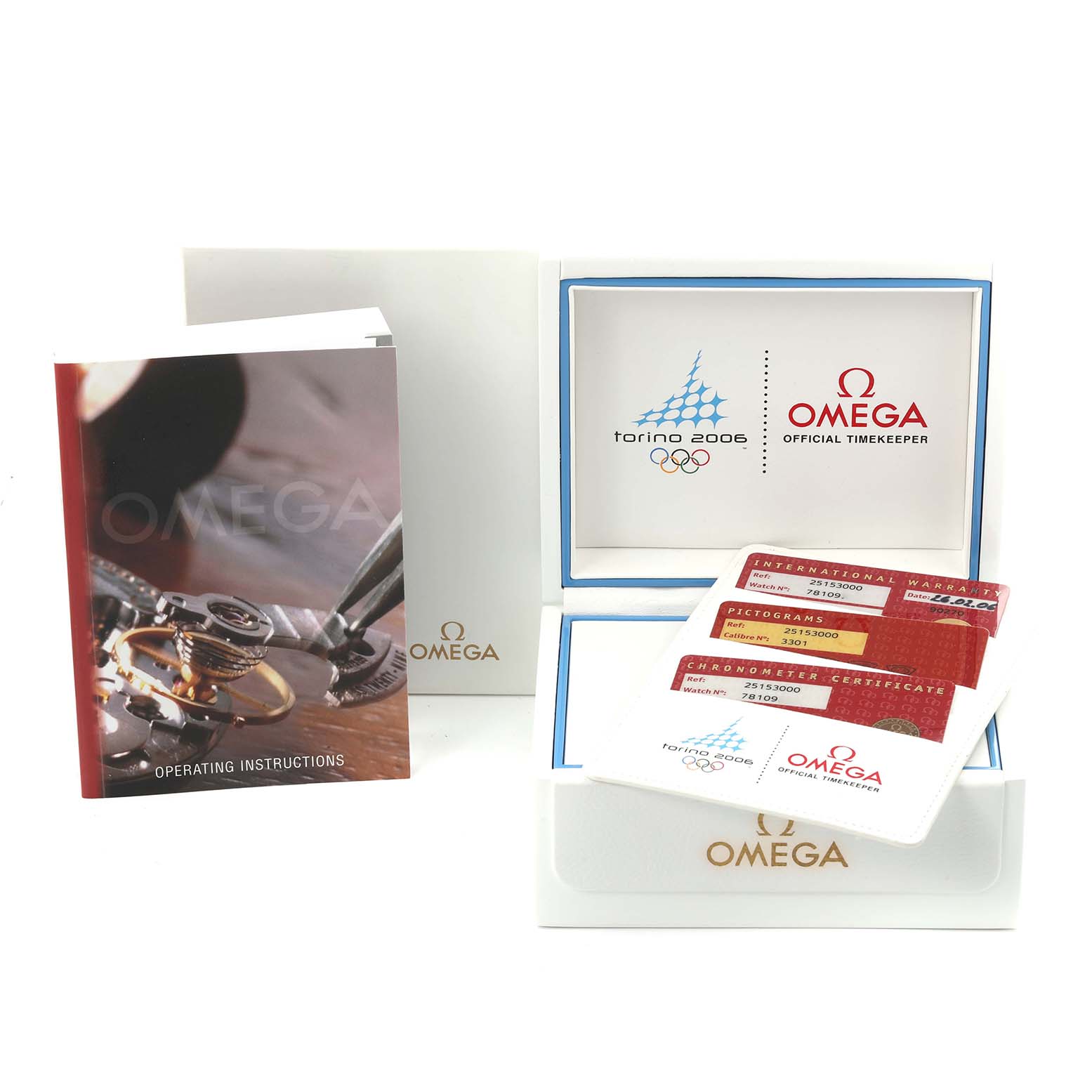 The image shows an Omega Aqua Terra 2515.30.00 Men's Stainless Steel Silver Dial 2515.30.00 Men's Stainless Steel Silver Dial box, operating instructions, warranty cards, and certificate from a top angle.