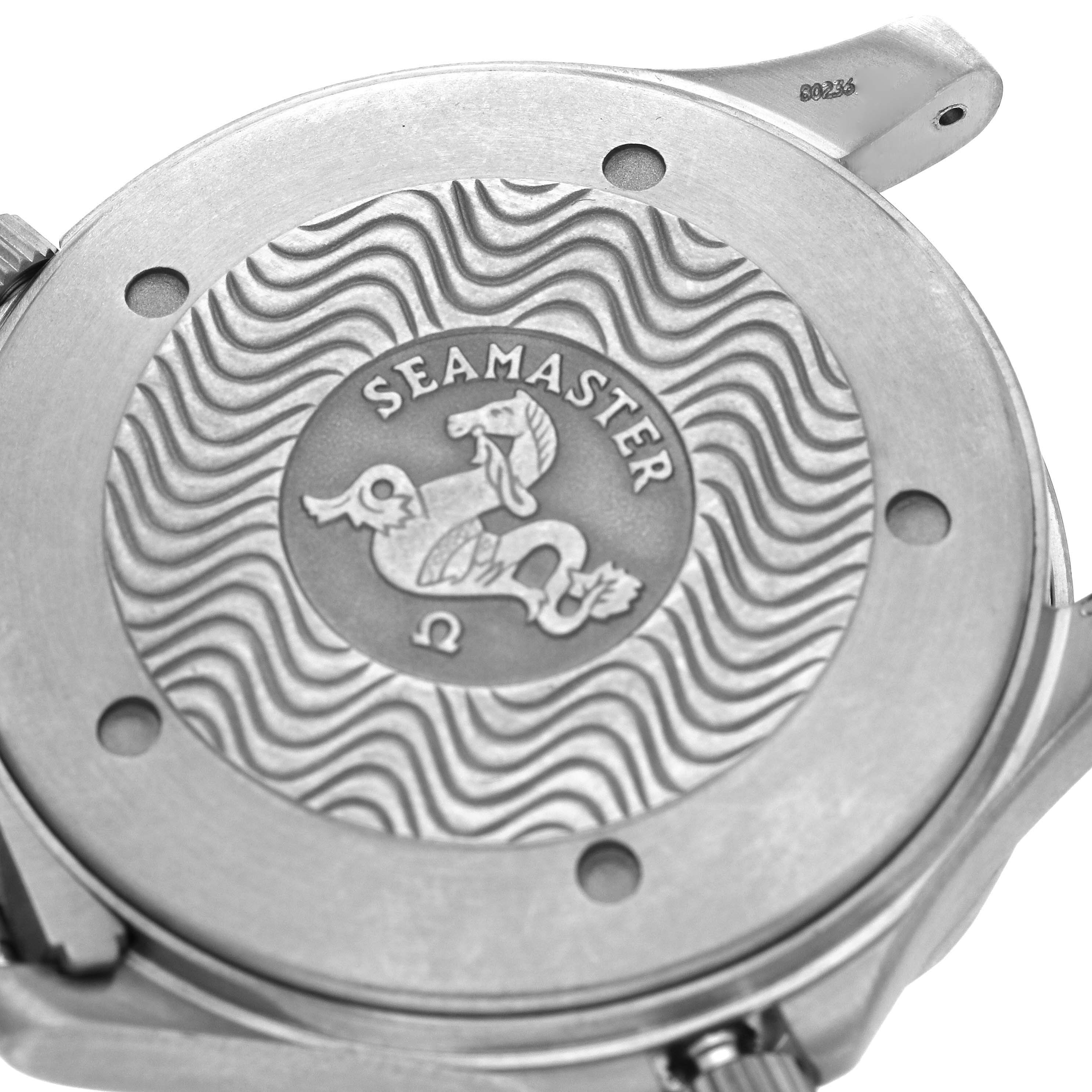 The image shows the case back of an Omega Seamaster 2231.80.00 Men's Titanium Blue Dial 2231.80.00 Men's Titanium Blue Dial watch with a wave pattern and logo engraving.