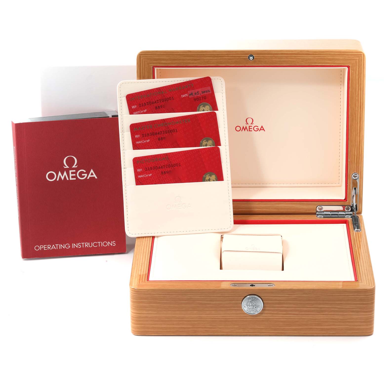 The image shows the accessories for an Omega Planet Ocean 215.30.44.22.01.001 Men
s Stainless Steel Black Dial 215.30.44.22.01.001 Men
s Stainless Steel Black Dial watch, including a wooden box, cards, and operating instructions.