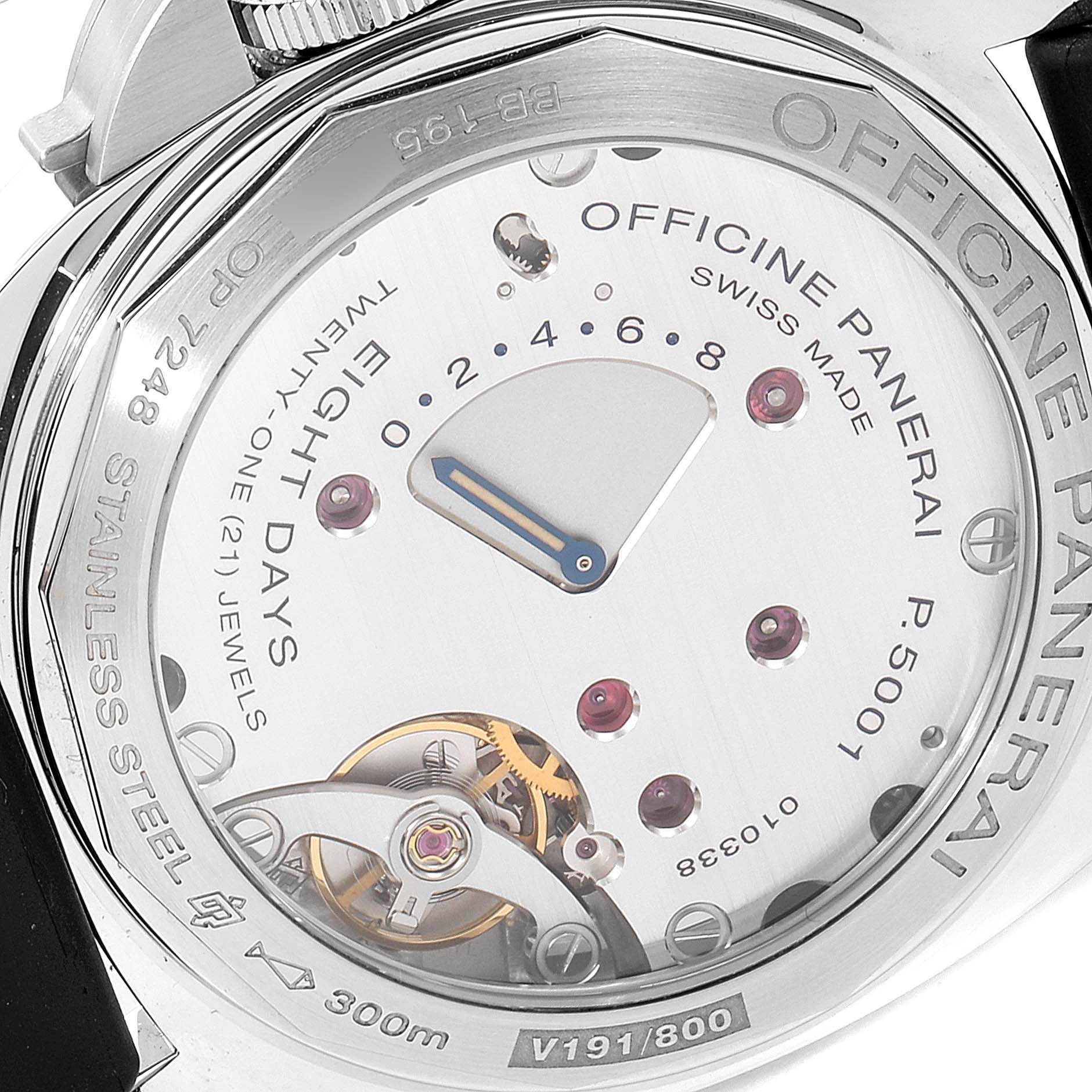 The image shows the back view of a Panerai Luminor PAM00796 Men
s Stainless Steel Black Dial PAM00796 Men
s Stainless Steel Black Dial watch, displaying its internal mechanism and inscriptions.