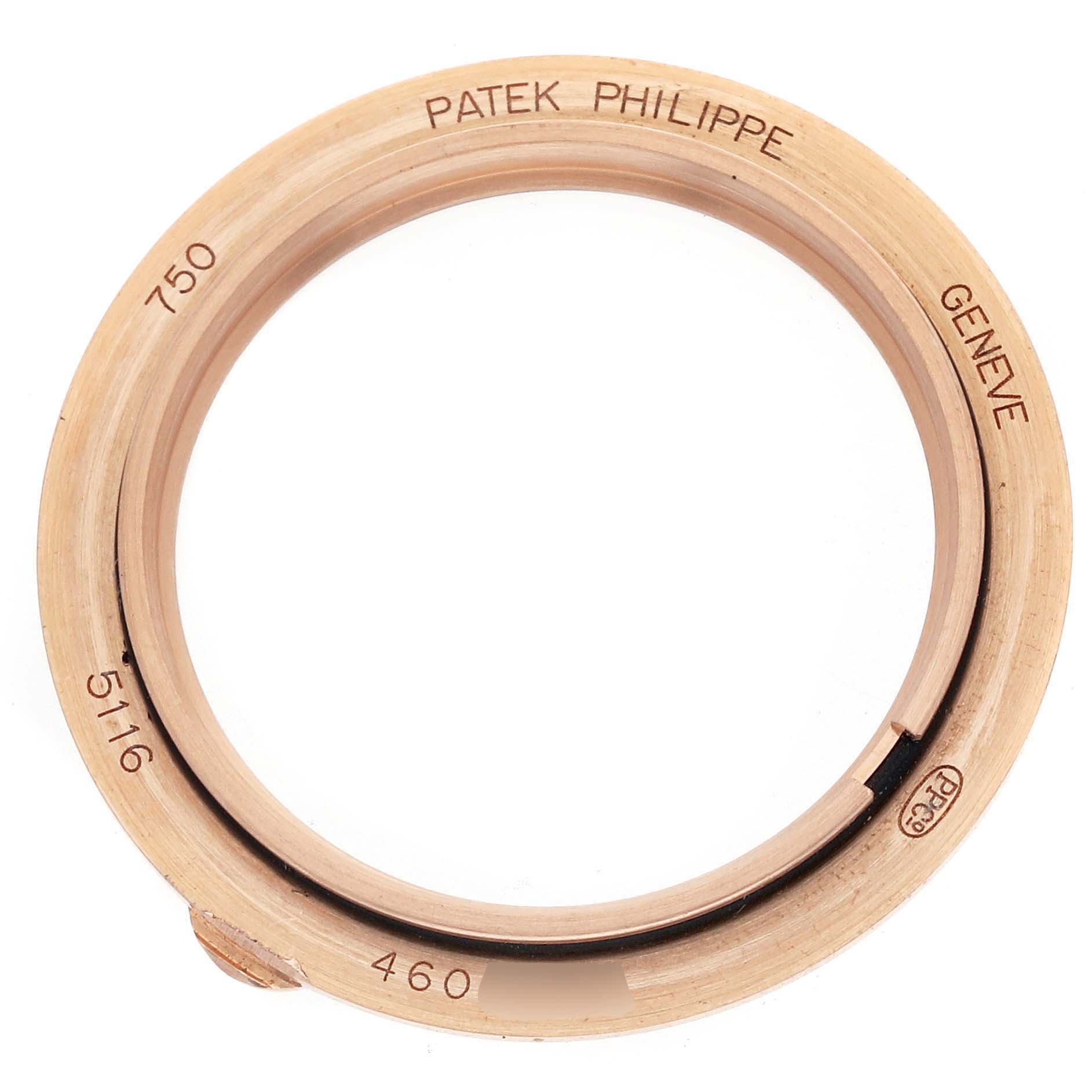 The image shows a top-down view of the Patek Philippe Calatrava 5116R Men's Rose Gold White Dial bezel or case part, engraved with branding details.