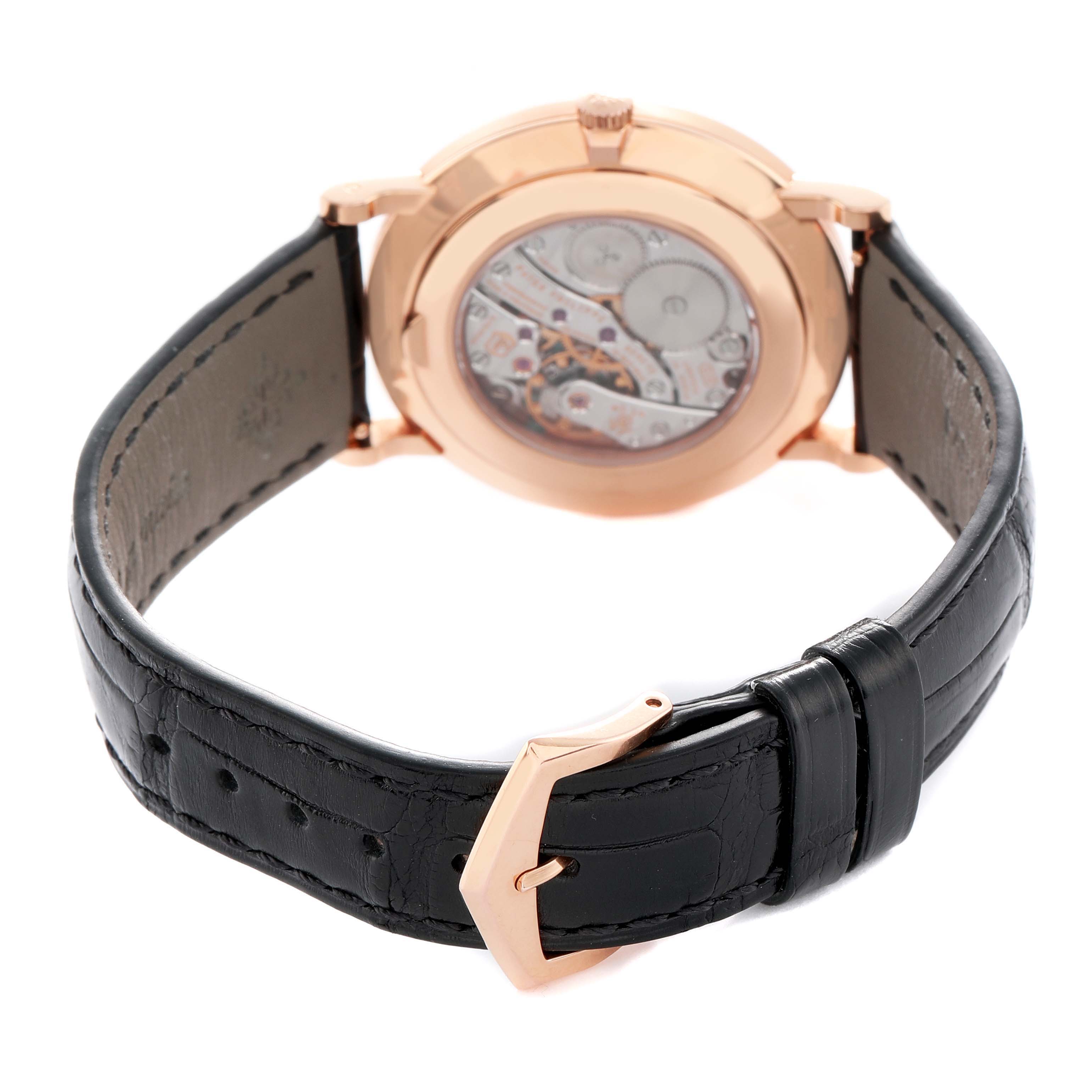 The image shows the back view of a Patek Philippe Calatrava 5116R Men's Rose Gold White Dial, highlighting the movement and leather strap.