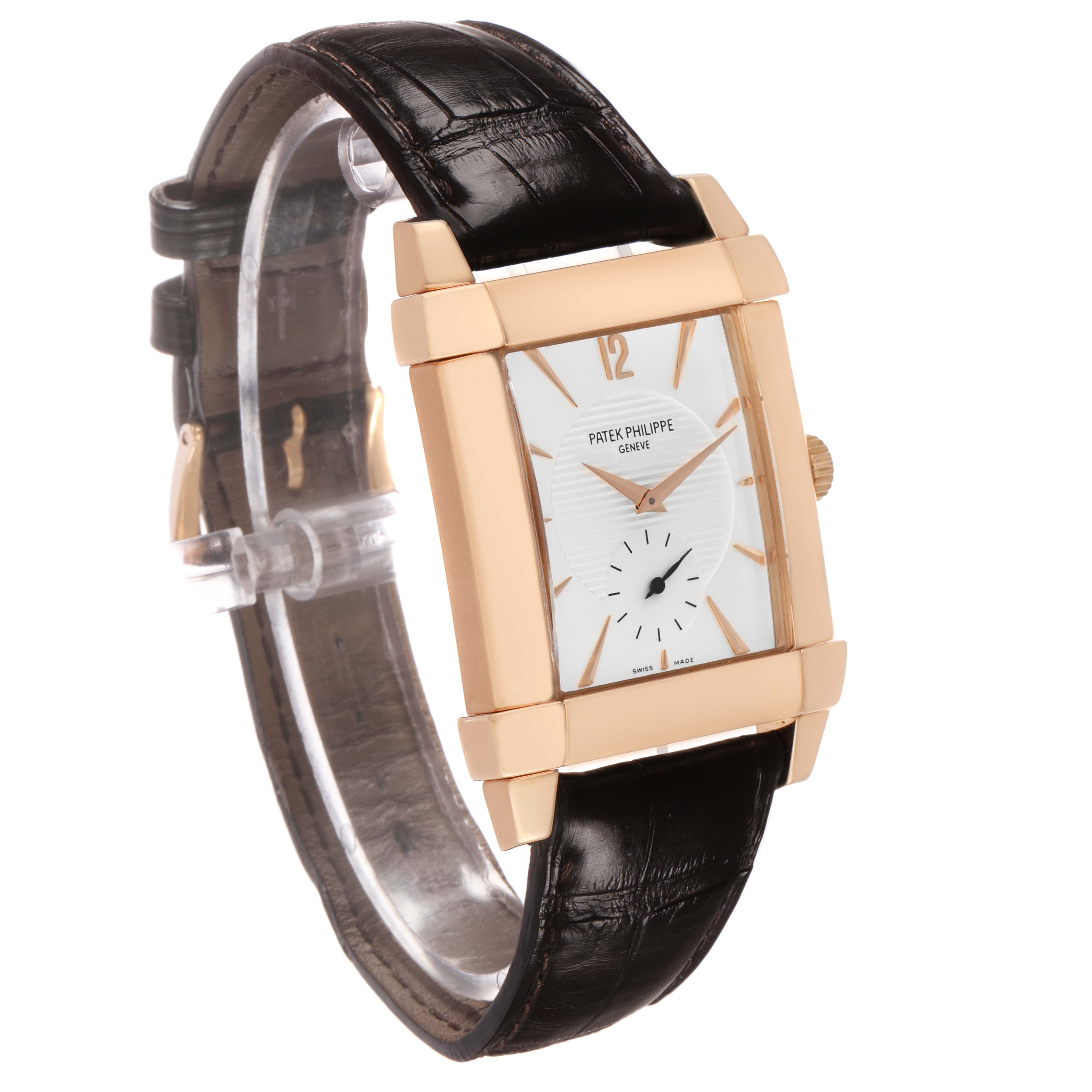 The Patek Philippe Gondolo 5111 5111R Men's Rose Gold Silver Dial watch is shown at a three-quarter angle, highlighting the gold case, rectangular dial, and leather strap.