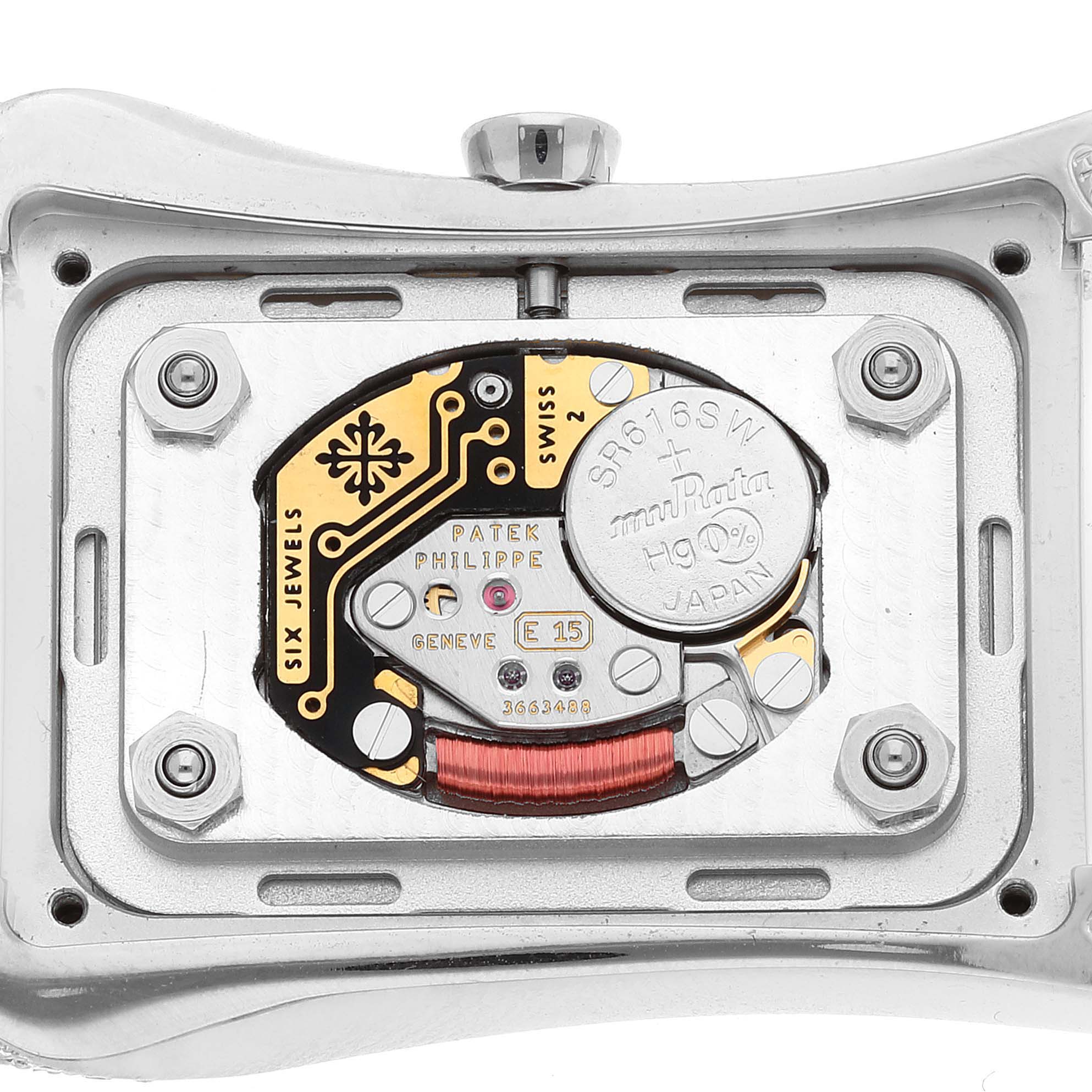 The image shows the back view of the Patek Philippe Gondolo 4972G-001 Women's White Gold Mother of Pearl Dial watch, focusing on its intricate movement and components.