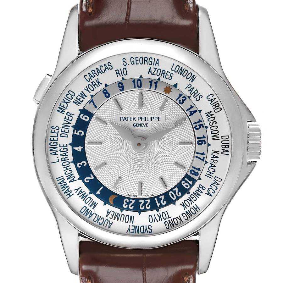 The Patek Philippe Complications watch is shown from the front, displaying the face, time zones, and dial details.