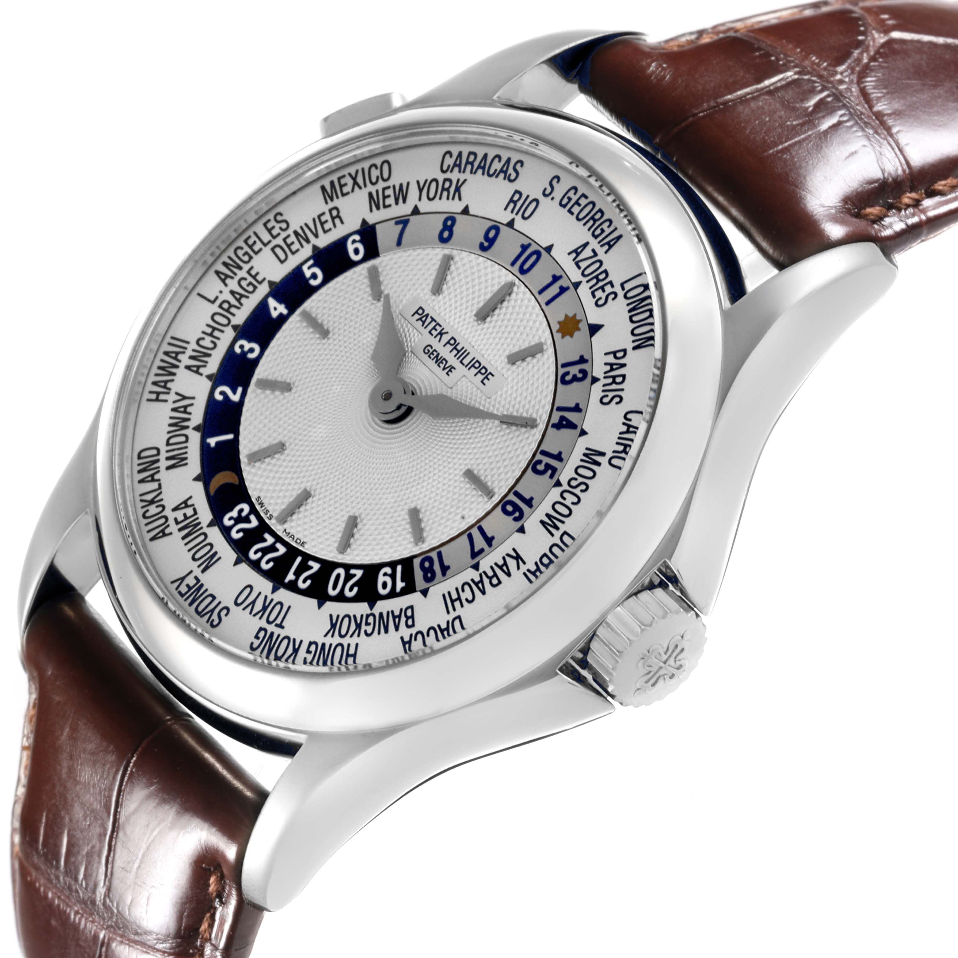The image shows a Patek Philippe Complications 5110G-001 Men's White Gold Silver Dial 5110G-001 Men's White Gold Silver Dial watch from a three-quarter angle, highlighting the dial, bezel, and crown.