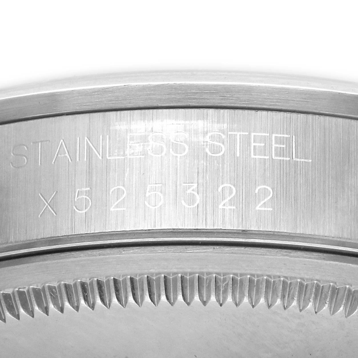 The image shows a close-up of the case and bezel edge of a Rolex Air-King 14000M Men's Stainless Steel Black Dial 14000M Men's Stainless Steel Black Dial, highlighting the stainless steel inscription.