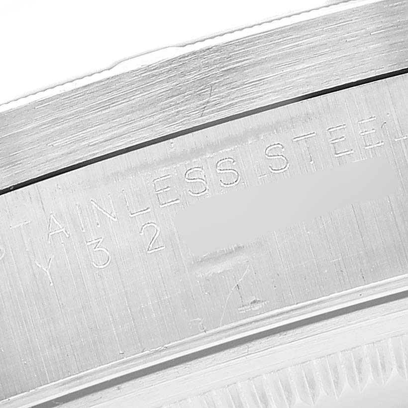 The image shows a close-up of the stainless steel casing with engravings on a Rolex Air-King 14010M Men's Stainless Steel Black Dial 14010M Men's Stainless Steel Black Dial watch.