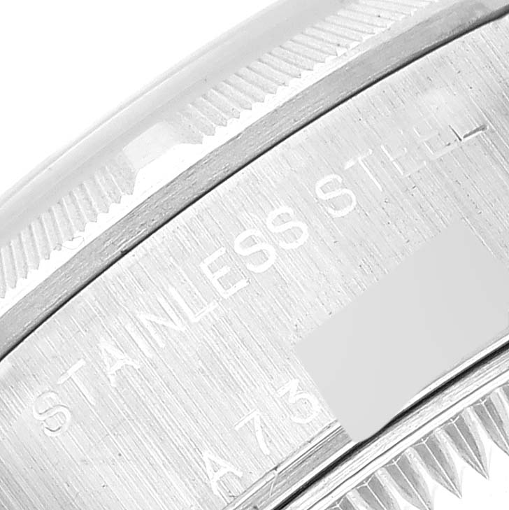 The image shows a close-up of the stainless steel casing of a Rolex Date 79190 Women's Stainless Steel Pink Dial 79190 Women's Stainless Steel Pink Dial model watch.