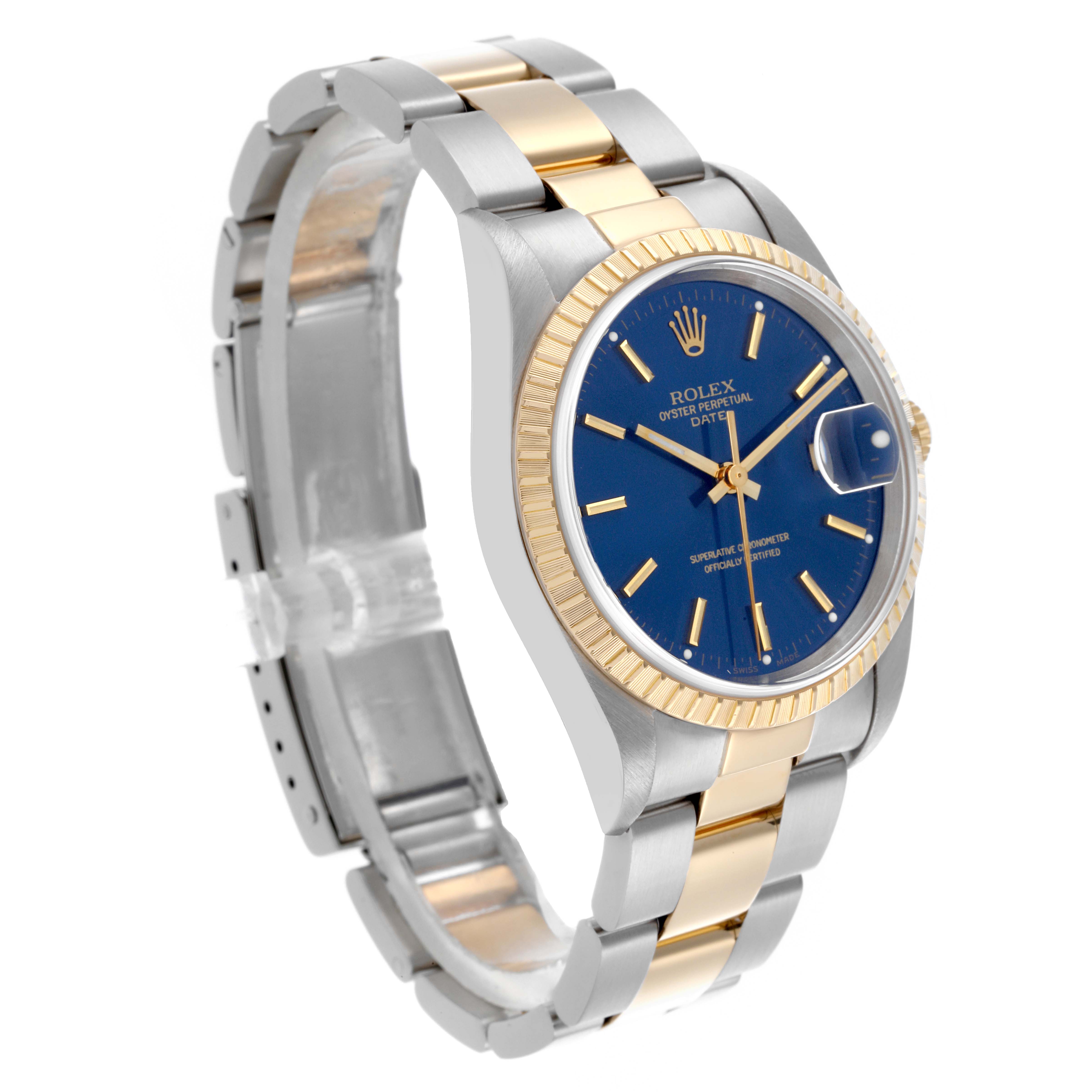The Rolex Date 15223 Men
s Steel and Gold (two tone) Blue Dial 15223 Men
s Steel and Gold (two tone) Blue Dial watch is shown from a side and slightly angled view, highlighting the gold and silver bracelet, blue dial, and fluted bezel.