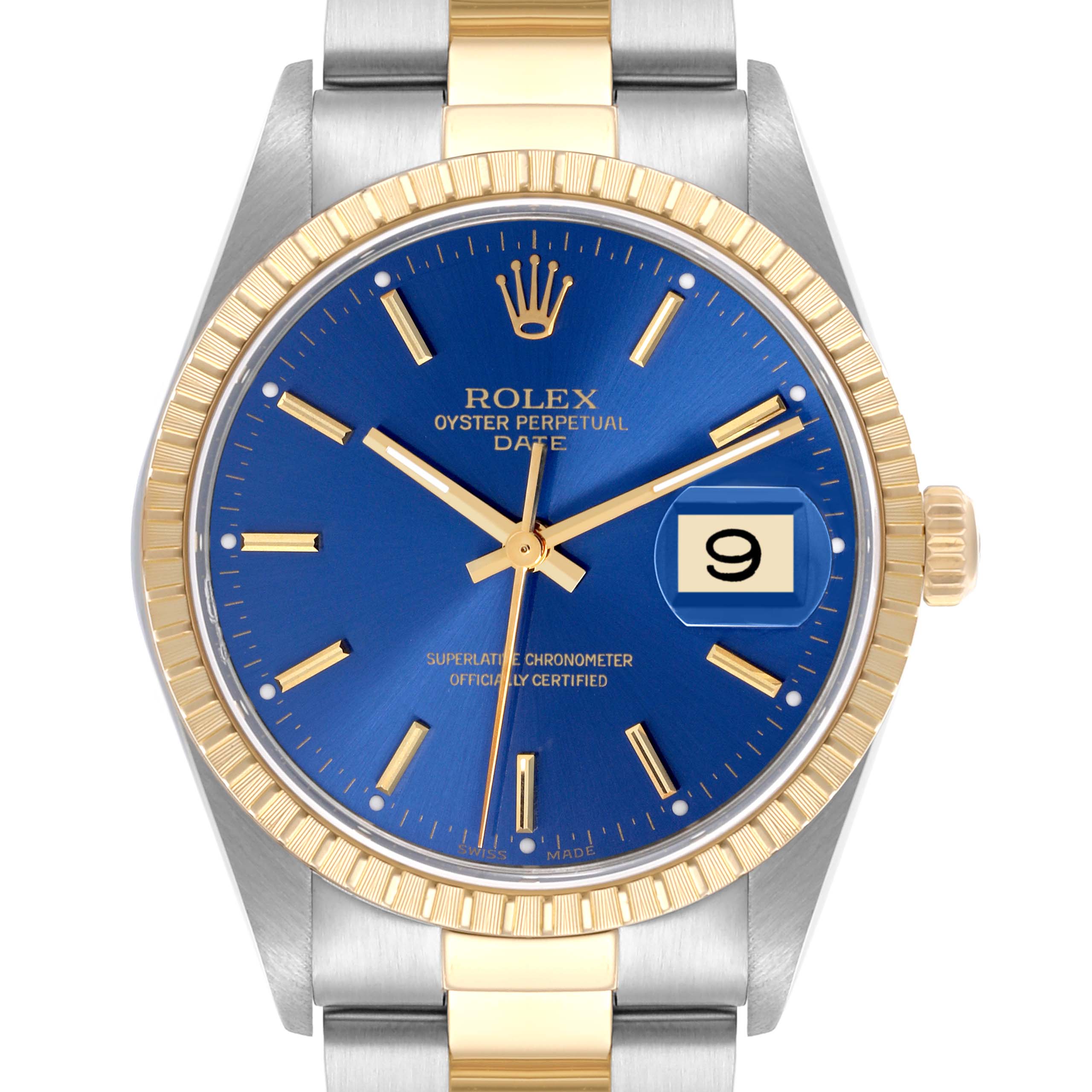 The Rolex Date 15223 Men
s Steel and Gold (two tone) Blue Dial 15223 Men
s Steel and Gold (two tone) Blue Dial watch is shown from a front angle, displaying the blue dial, gold bezel, and part of the two-tone bracelet.