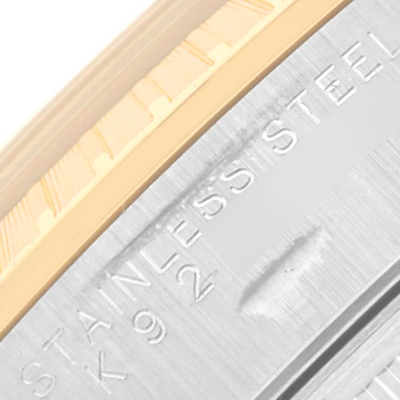 The image shows a close-up of the side of a Rolex Date 15223 Men
s Steel and Gold (two tone) Blue Dial 15223 Men
s Steel and Gold (two tone) Blue Dial model, highlighting the stainless steel material.