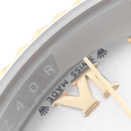 The image shows a close-up of the dial and gold index markers on a Rolex Datejust 279173 Women's Steel and Gold (two tone) Silver Dial 279173 Women's Steel and Gold (two tone) Silver Dial watch, focusing on the "SWISS MADE" text.