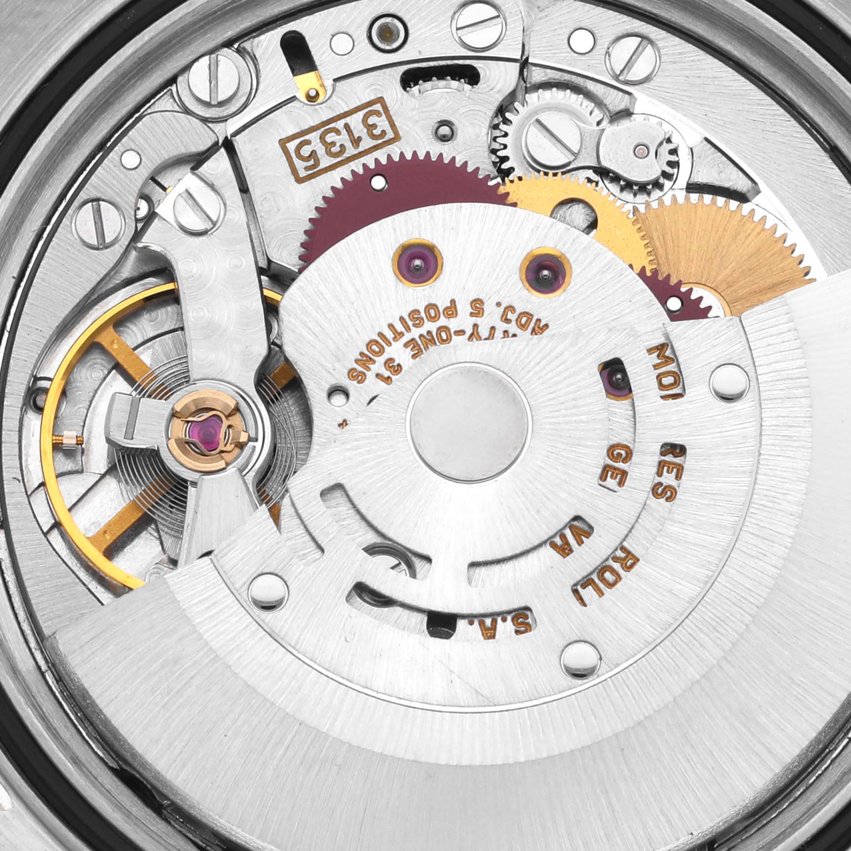 The image shows a close-up view of the internal mechanics of a Rolex Datejust 16233 Men's Steel and Gold (two tone) Grey Dial 16233 Men's Steel and Gold (two tone) Grey Dial watch, featuring gears and movement components.